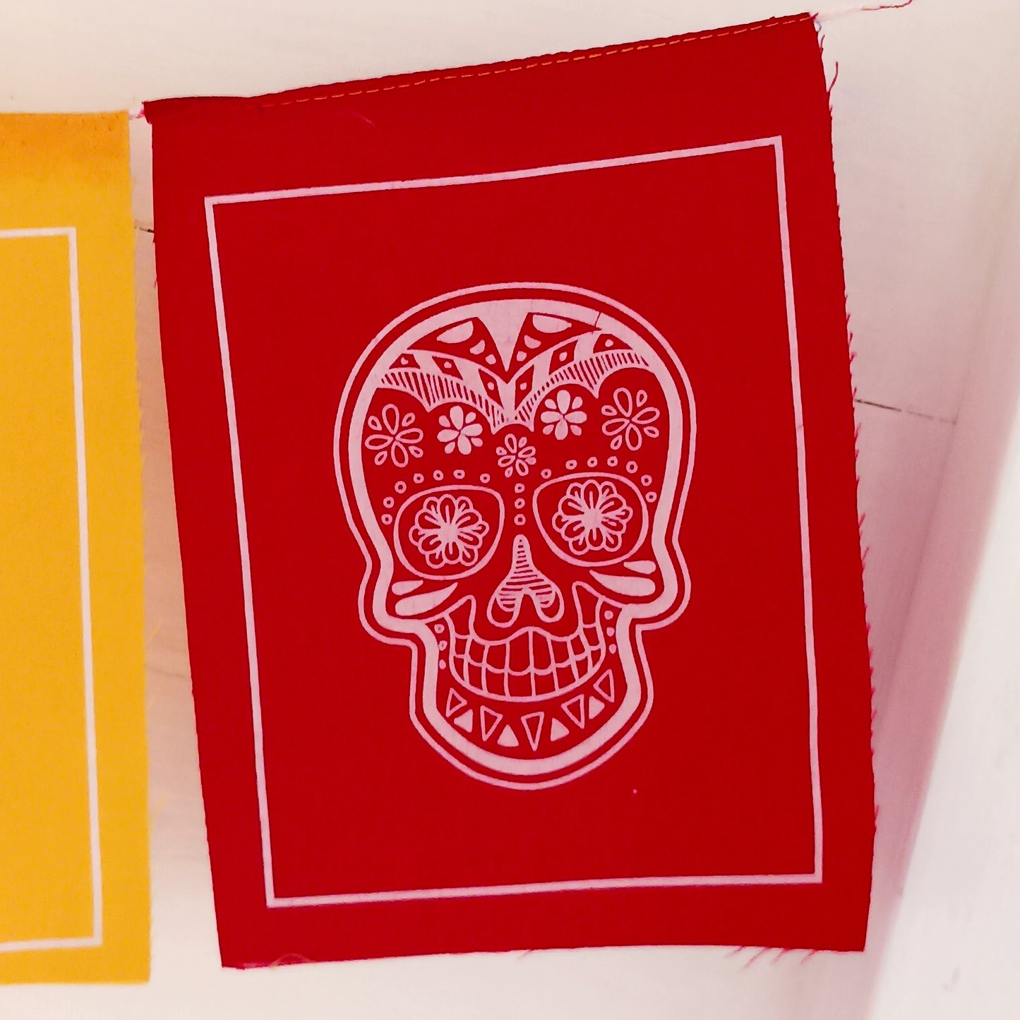 These bright Sugar Skull prayer flags will bring a small piece of colorful Mexican culture to your home.