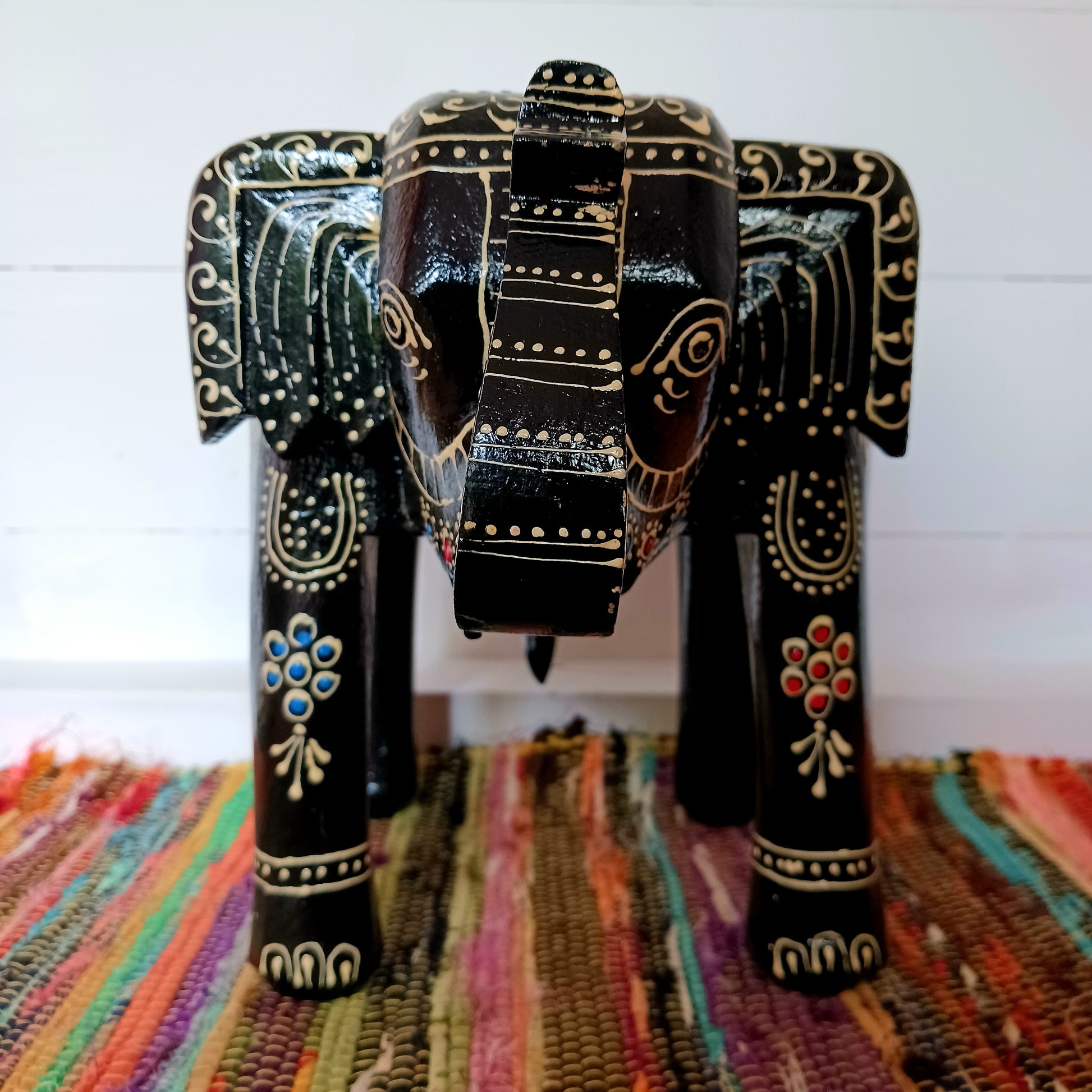 These beautifully hand painted footstools are shaped as elephants and decorated with traditional Indian designs.