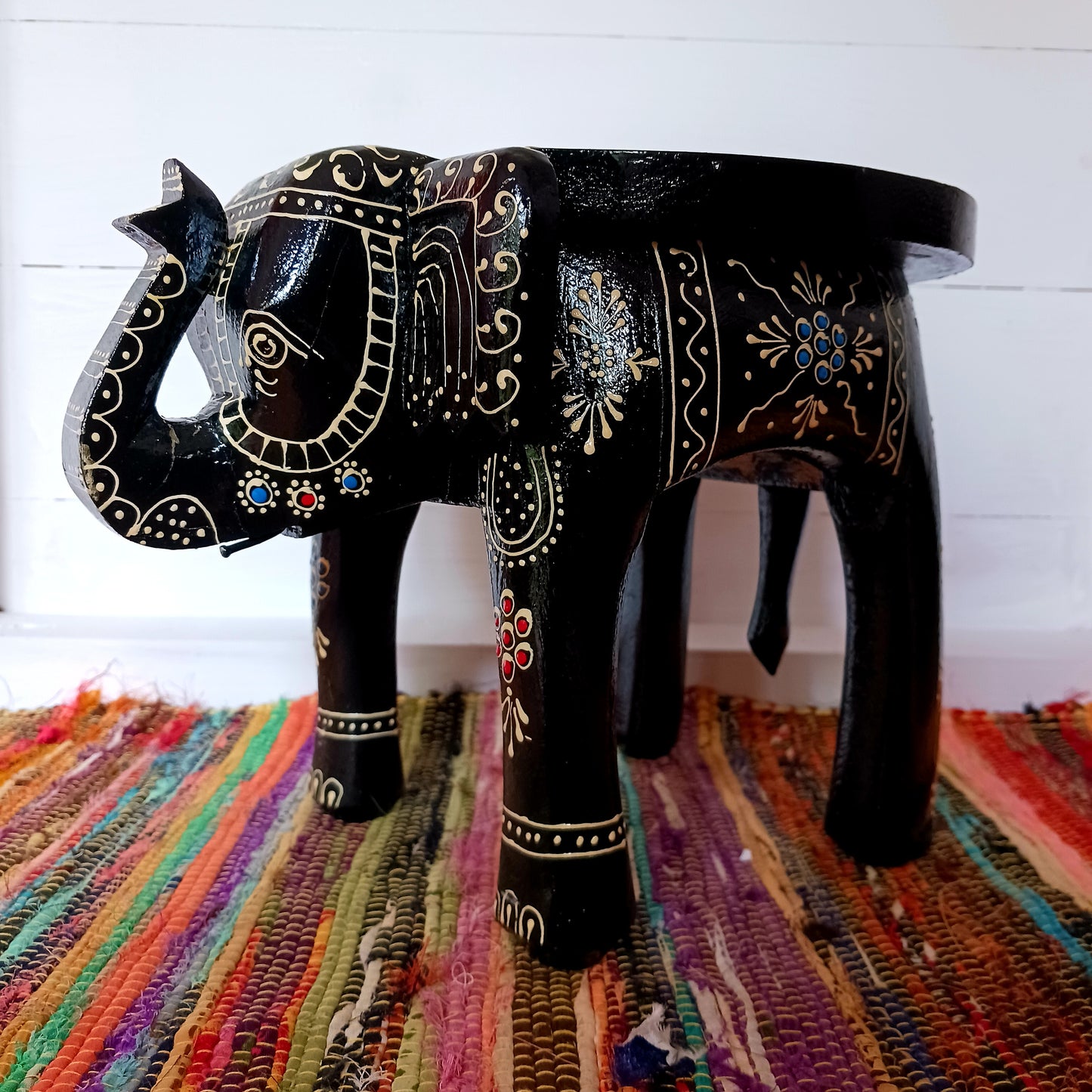 These beautifully hand painted footstools are shaped as elephants and decorated with traditional Indian designs.