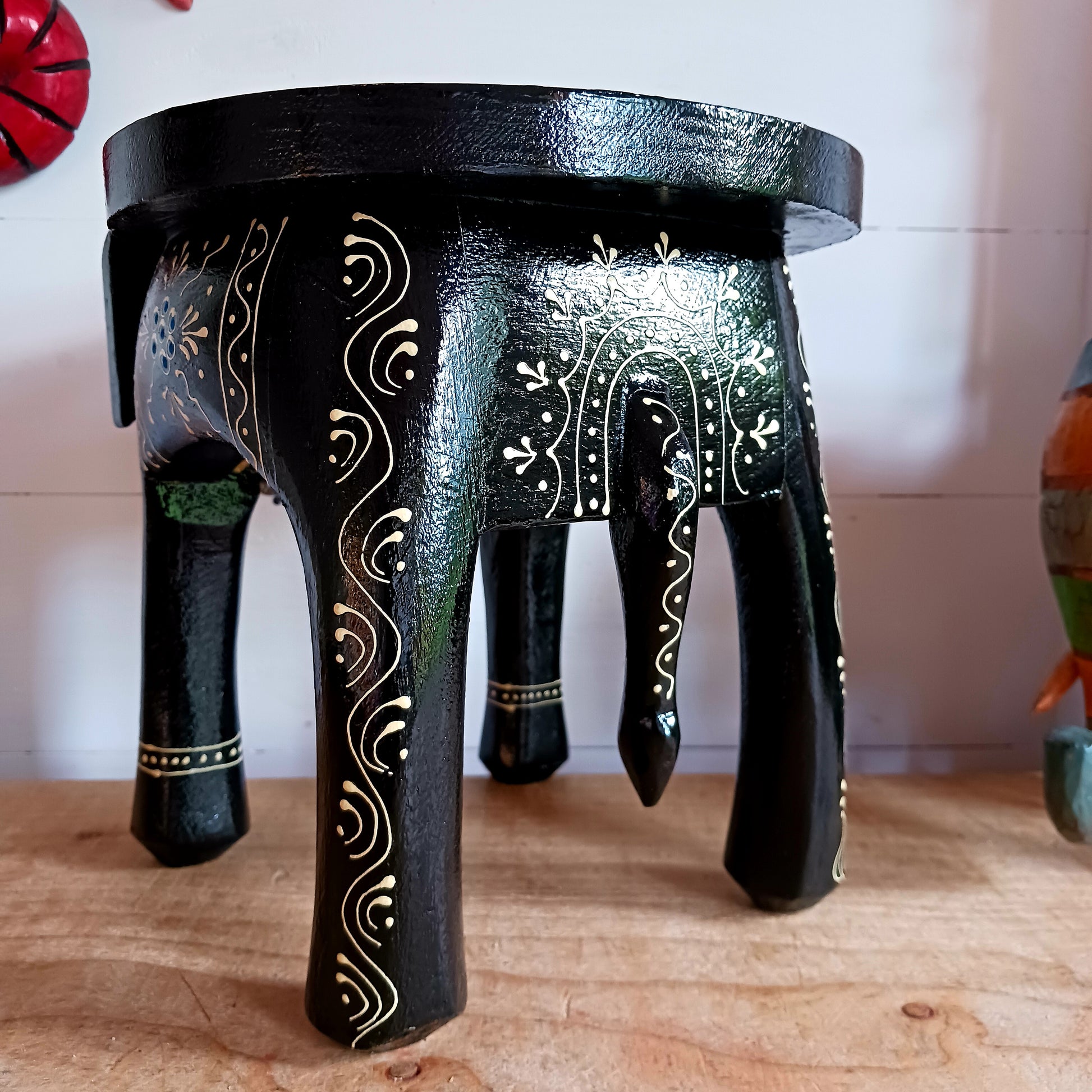 These beautifully hand painted footstools are shaped as elephants and decorated with traditional Indian designs.