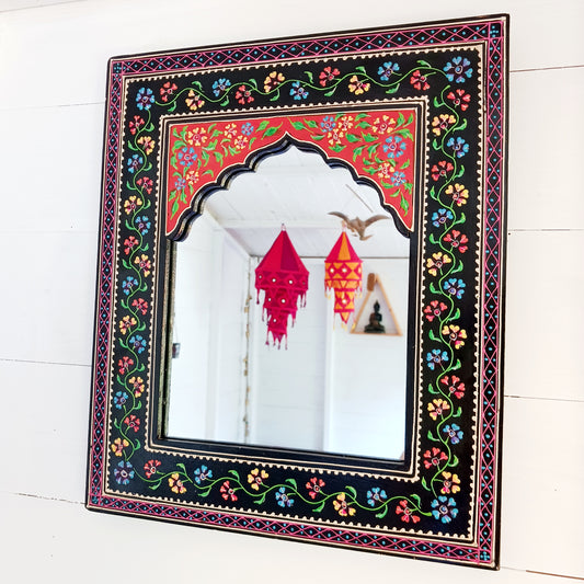 These beautiful Indian mirrors are made from sustainable mango wood and hand painted in a black floral design.