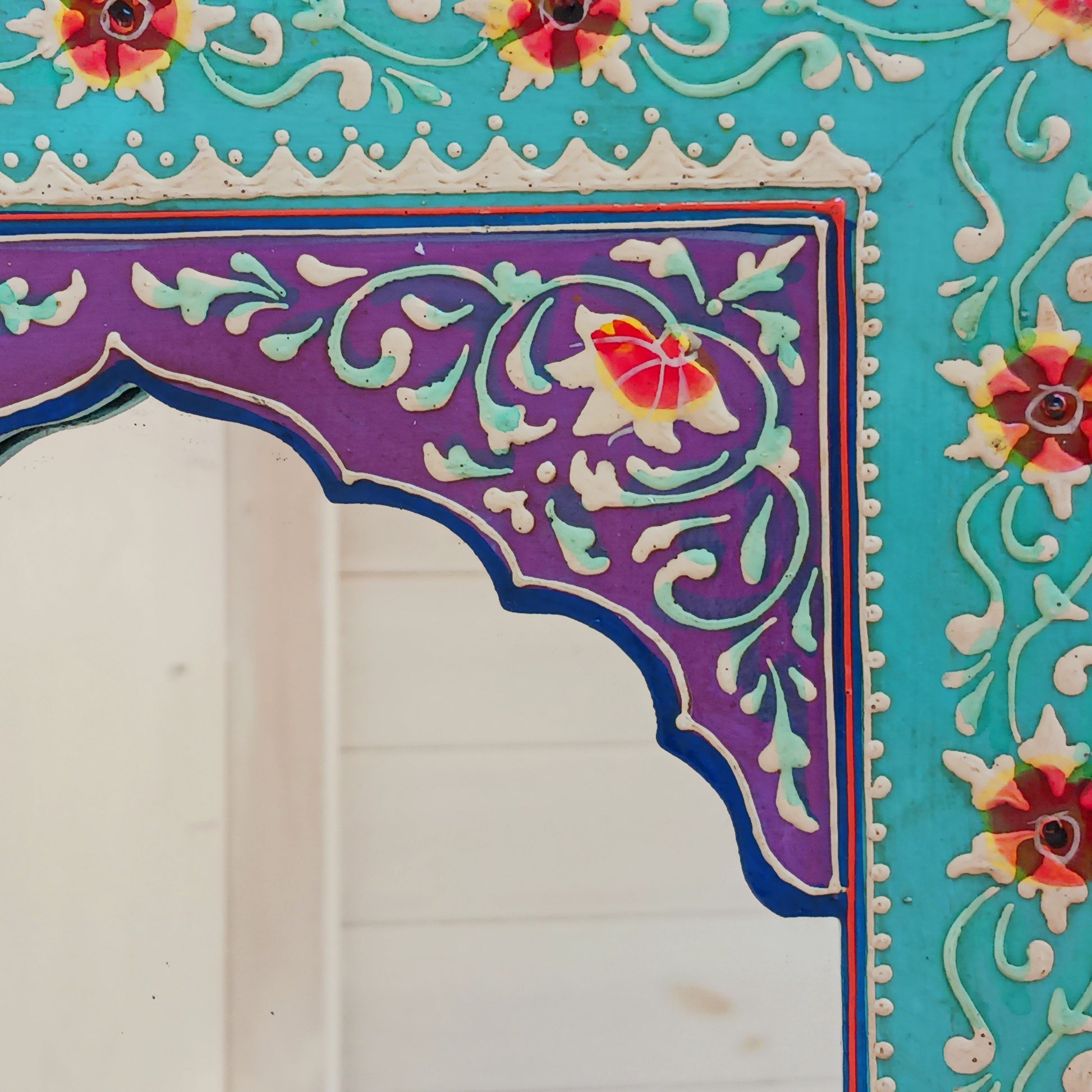 These beautiful Indian mirrors are made from sustainable mango wood and hand painted in a turquoise floral design.