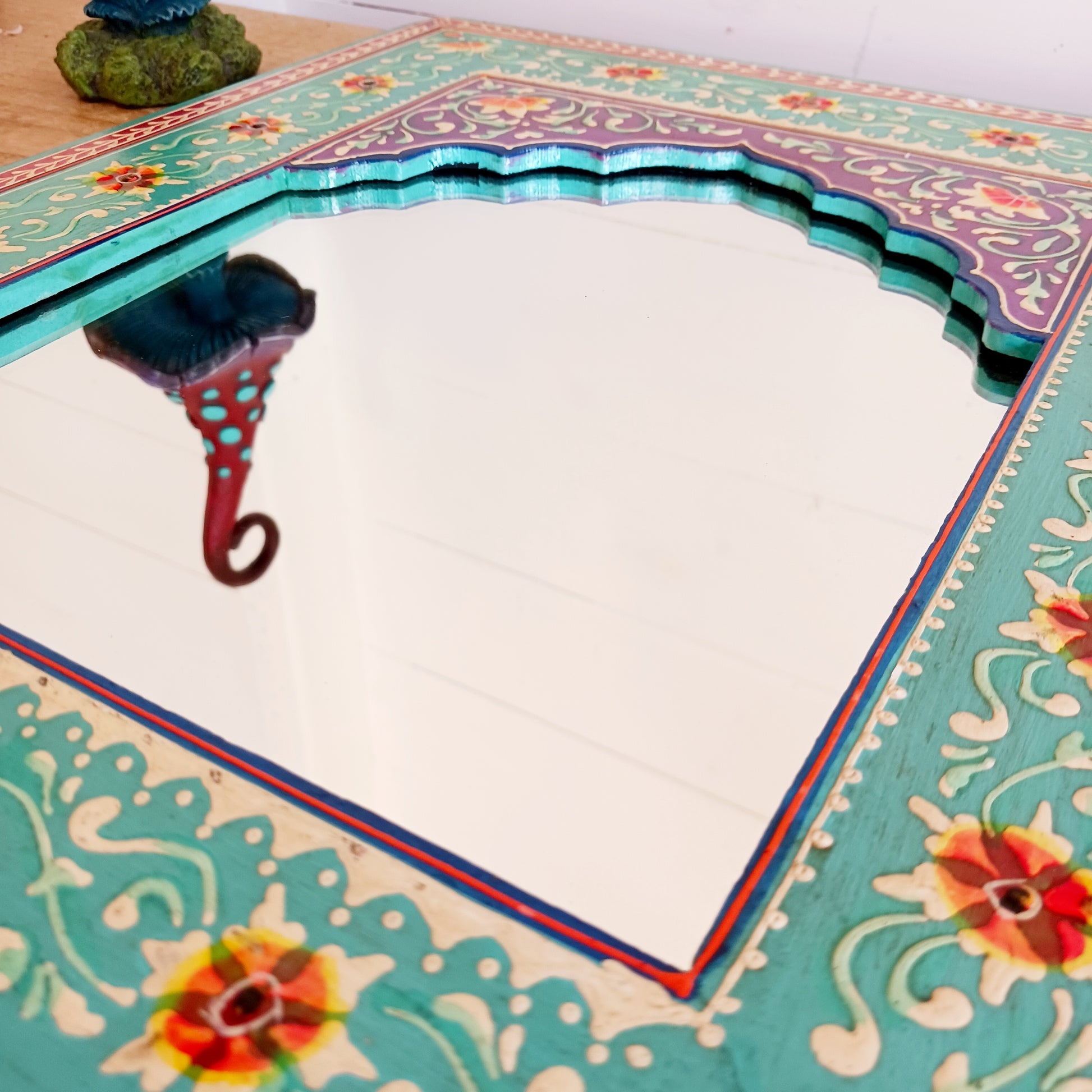 These beautiful Indian mirrors are made from sustainable mango wood and hand painted in a turquoise floral design.