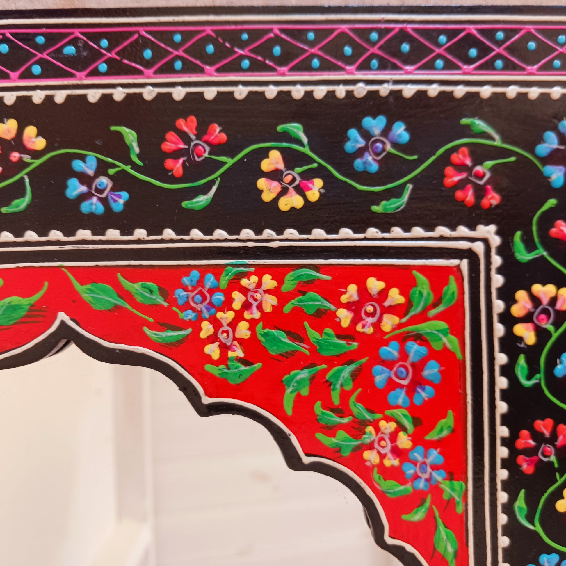 These beautiful Indian mirrors are made from sustainable mango wood and hand painted in a black floral design.