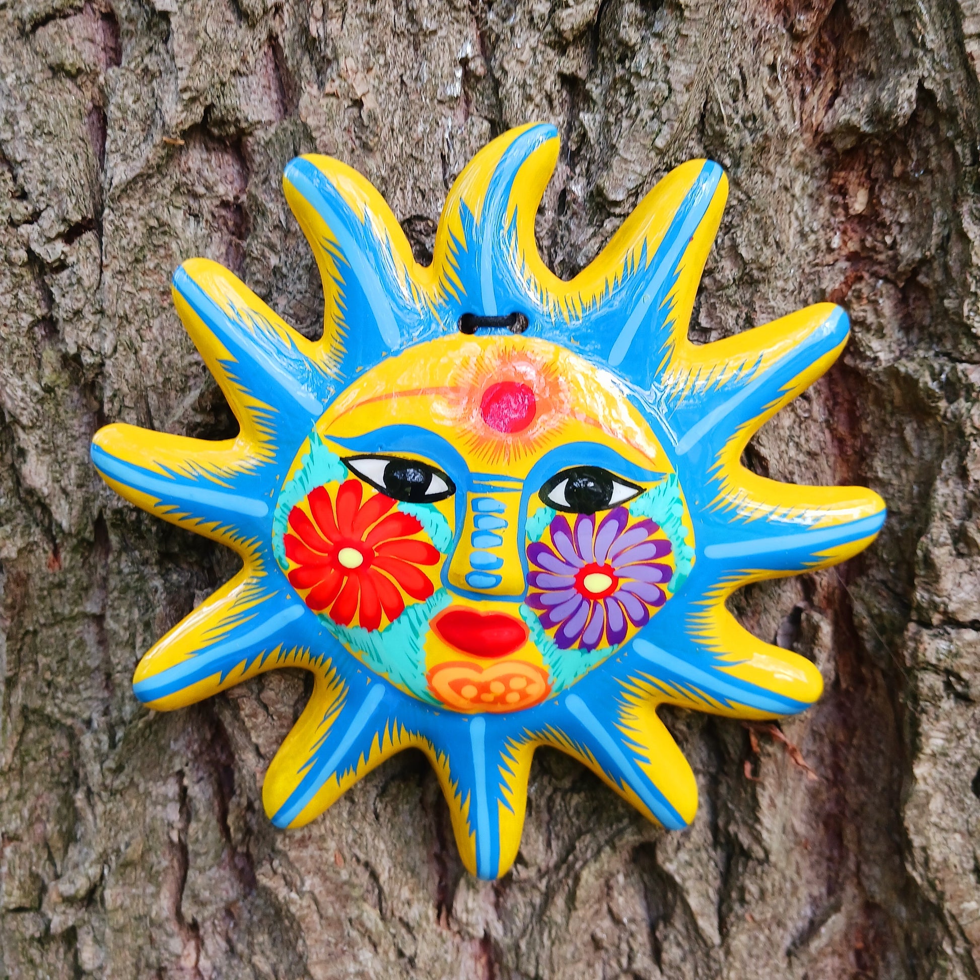 This sunny and vibrant wall plaque will get you smiling! It has been beautifully handpainted in a bright style traditional to Xalitla, a region of Guerrero, Mexico.