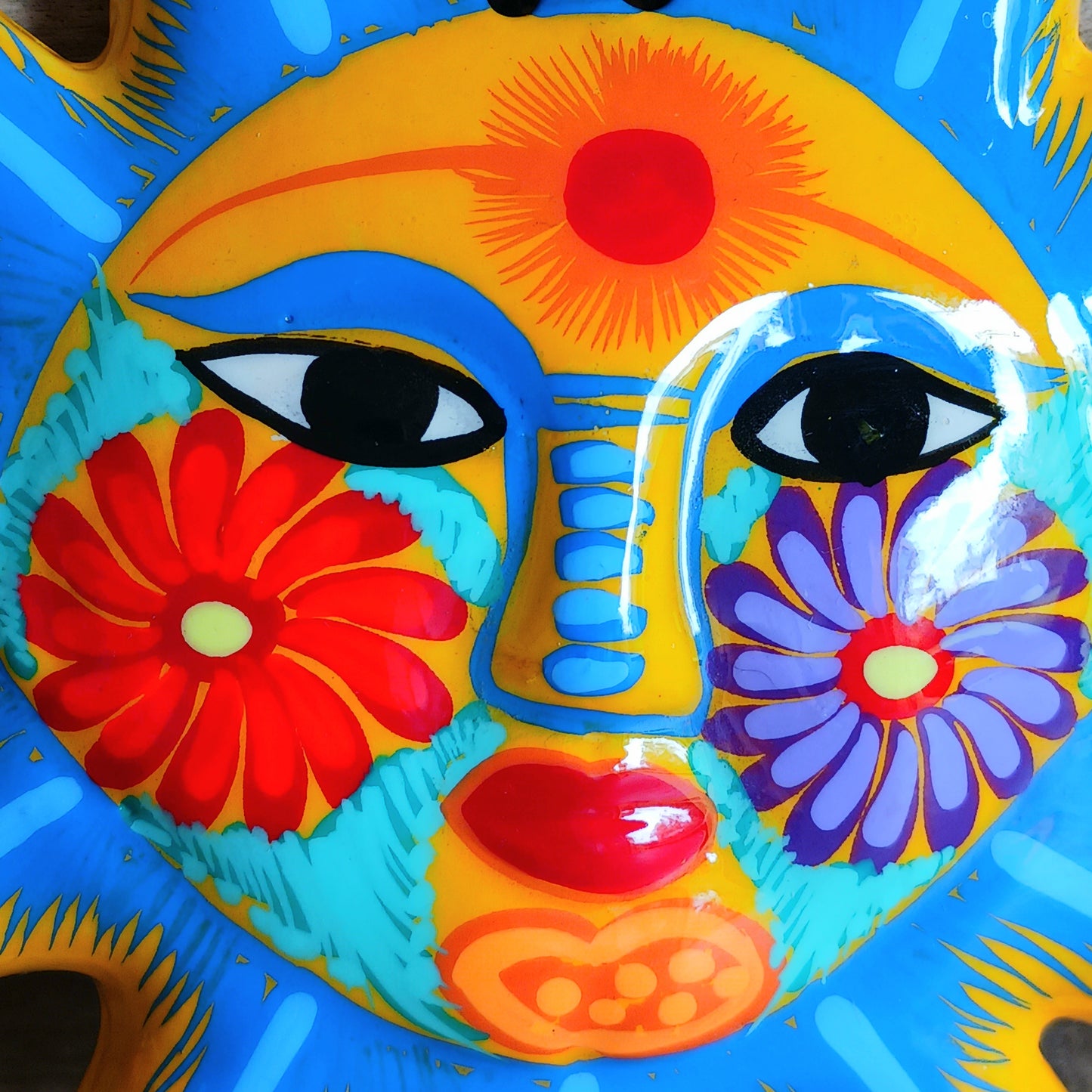 This sunny and vibrant wall plaque will get you smiling! It has been beautifully handpainted in a bright style traditional to Xalitla, a region of Guerrero, Mexico.