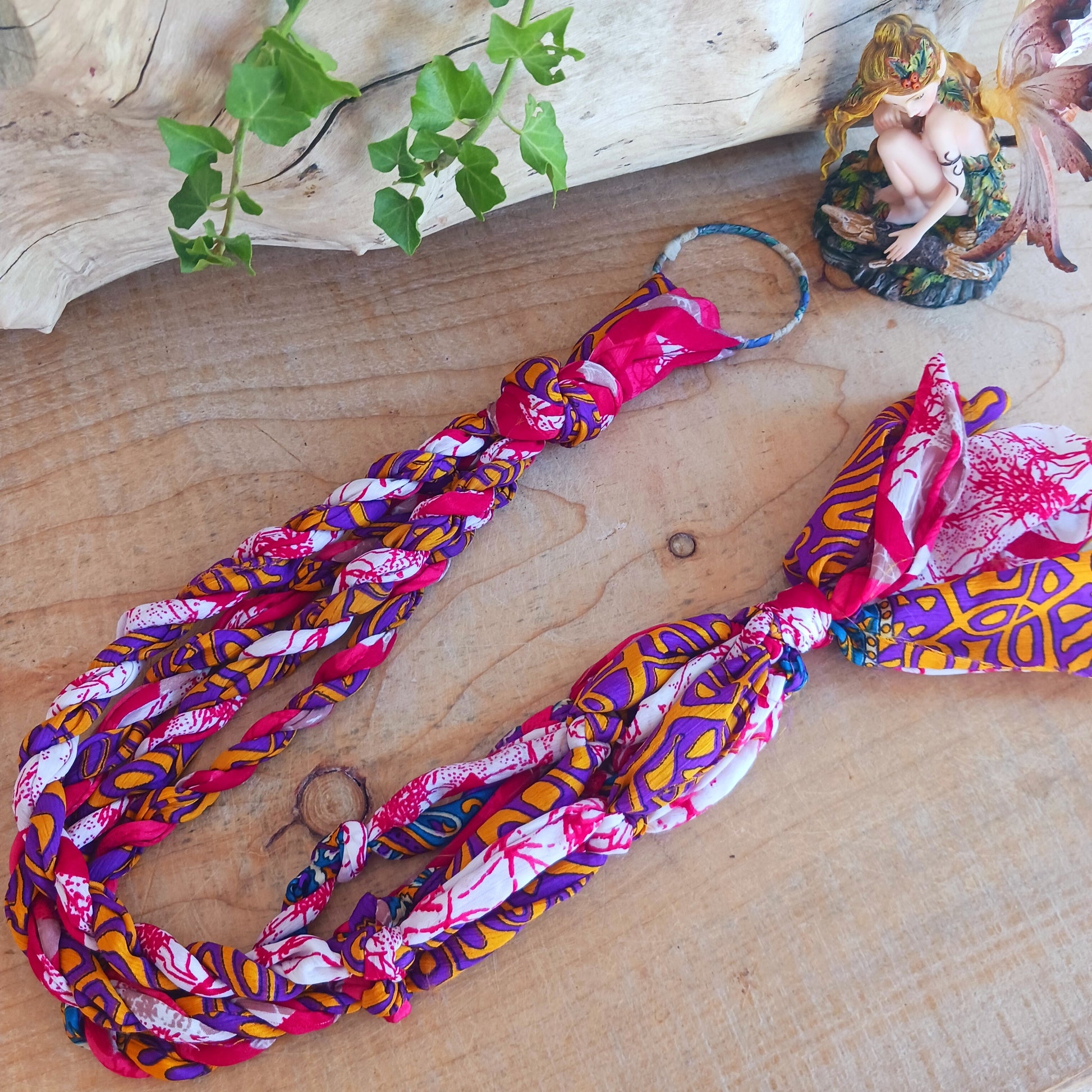 This beautiful handmade sari plant hanger will add a splash of colour and boho chic to your home. Made from scraps of used sari, its simple design ensures that no fabric is wasted but is re-purposed into an elegant product. 