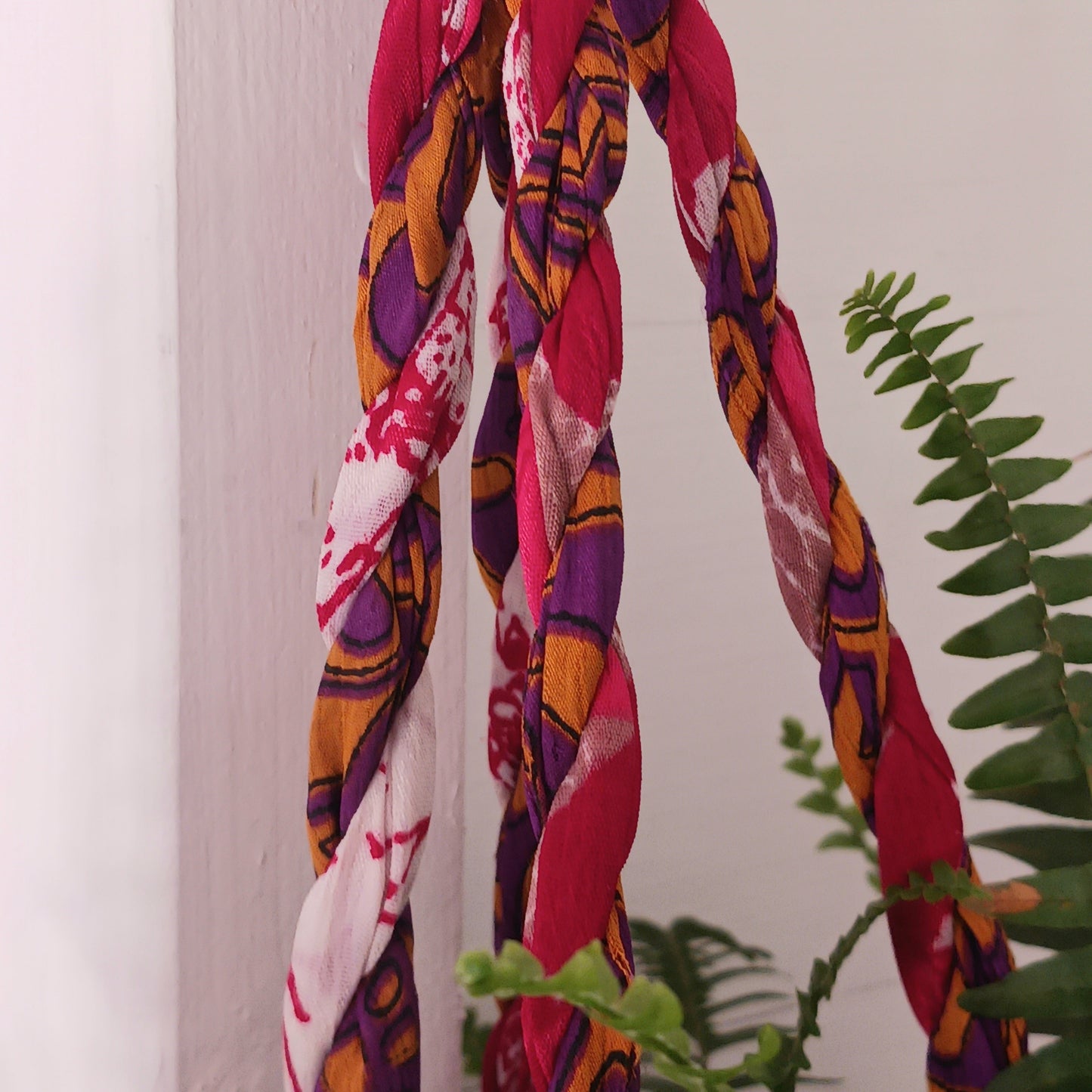 This beautiful handmade sari plant hanger will add a splash of colour and boho chic to your home. Made from scraps of used sari, its simple design ensures that no fabric is wasted but is re-purposed into an elegant product. 