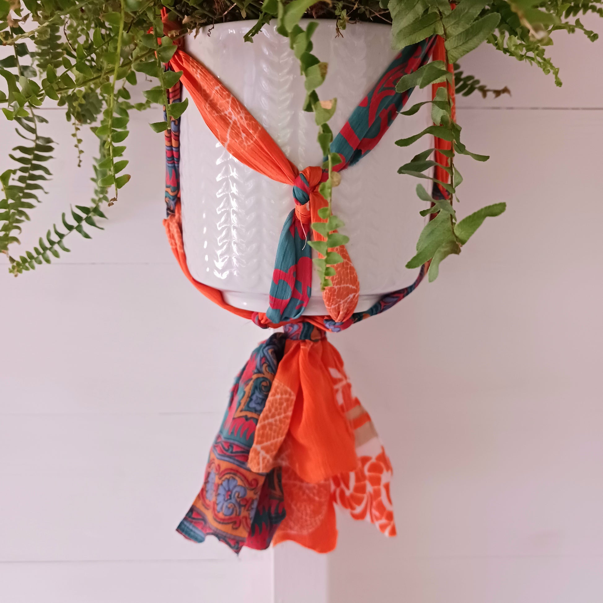 This beautiful handmade sari plant hanger will add a splash of colour and boho chic to your home. Made from scraps of used sari, its simple design ensures that no fabric is wasted but is re-purposed into an elegant product. 