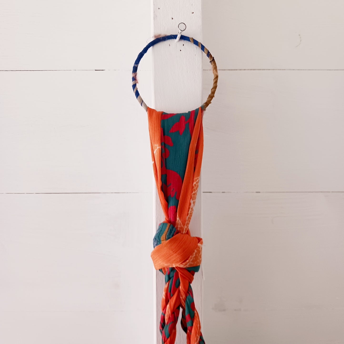 This beautiful handmade sari plant hanger will add a splash of colour and boho chic to your home. Made from scraps of used sari, its simple design ensures that no fabric is wasted but is re-purposed into an elegant product. 