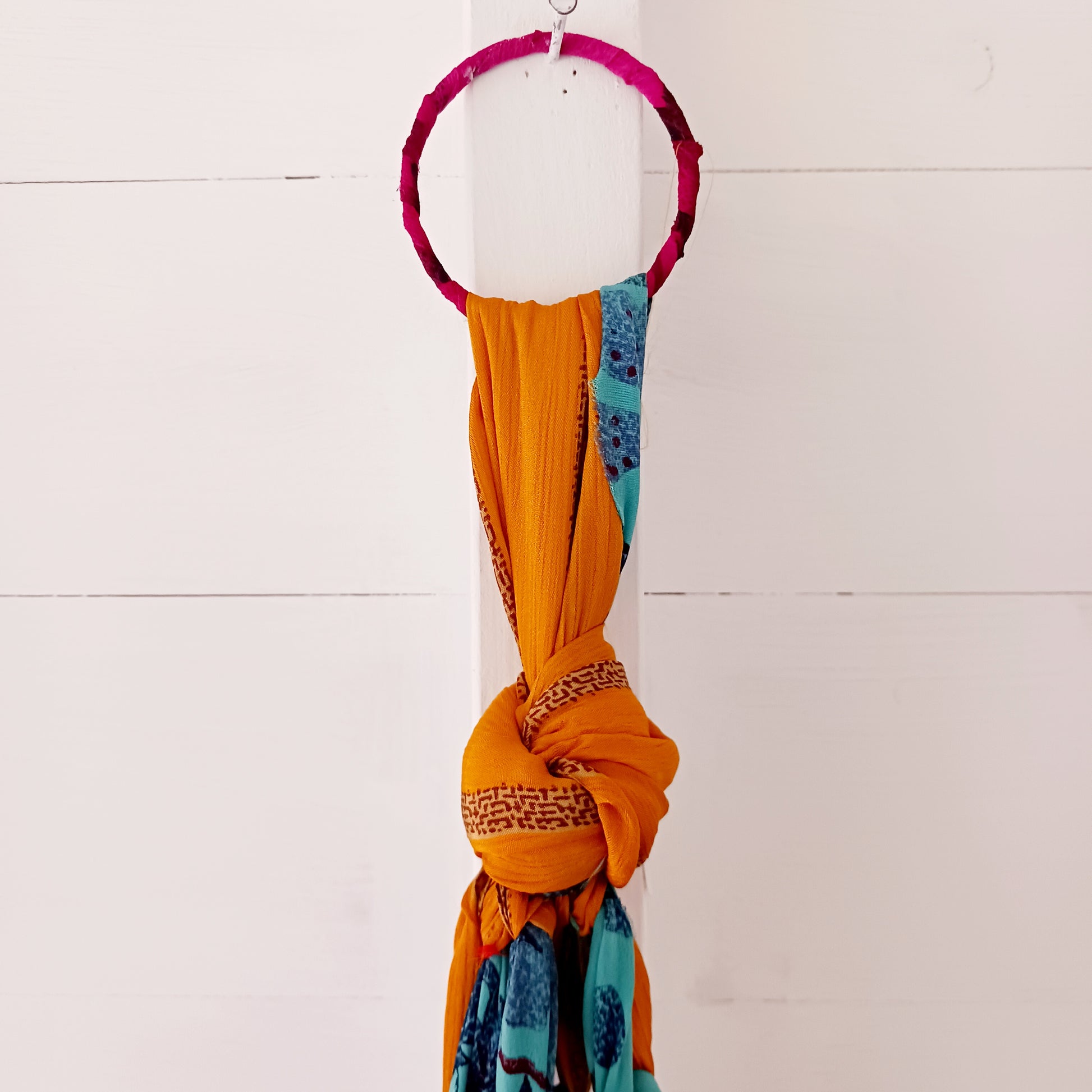 This beautiful handmade sari plant hanger will add a splash of colour and boho chic to your home. Made from scraps of used sari, its simple design ensures that no fabric is wasted but is re-purposed into an elegant product. 