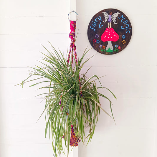 This beautiful handmade sari plant hanger will add a splash of colour and boho chic to your home. Made from scraps of used sari, its simple design ensures that no fabric is wasted but is re-purposed into an elegant product. 