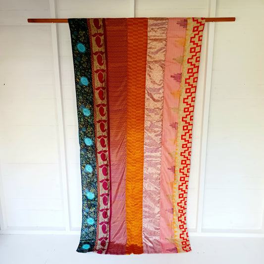 These beautiful curtains are handmade from assorted panels of Indian sari fabric, hand crafted into beautiful recycled curtain panels. The combined varieties of silky soft material are made with an easy to mount top hanging rod pocket.