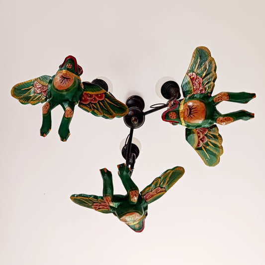 The Flying Frog Mobile is a beautiful and traditional piece of Balinese culture, featuring auspicious frogs that symbolize rain, fertility, and good fortune. Its rich colors and gold detailing make it a stunning addition to any space. Its strong twine and loop allow for easy hanging, and its winged spirit guardians are often used to ward off evil spirits in temples or homes.