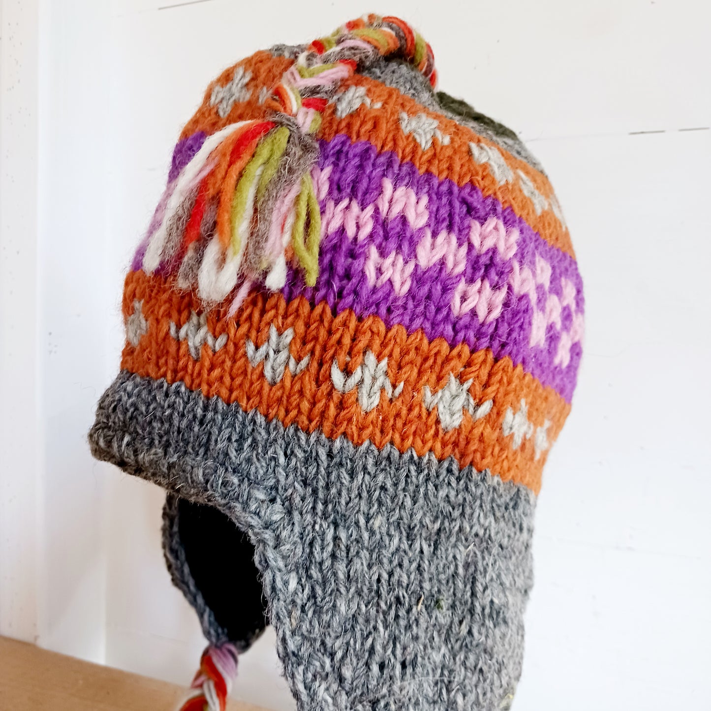 Chunky wool earflap hats hand made in Nepal with fleece lining for extra warmth and comfort, this handmade hat is awesomely warm.