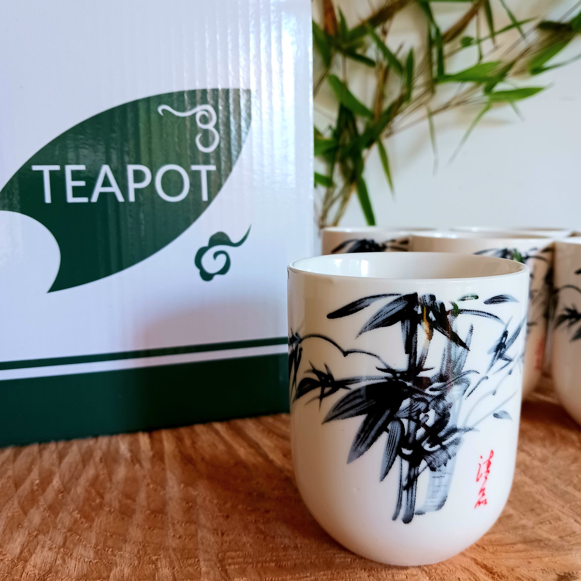 This beautiful Oriental Herbal Teapot Set is made in a ceramic white stone Oriental bamboo design.  Packed in a gift box, a teapot with a metal strainer in the lid, a detachable handle and six matching little cups.