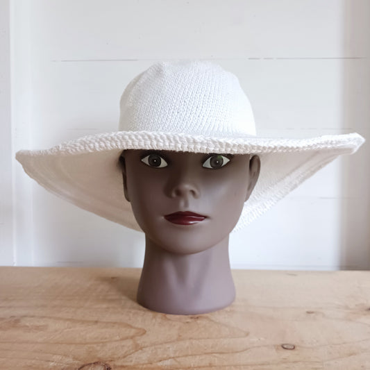 This lovely white crochet sun hat is handmade and Fairtrade from Indonesia. Each hat has a malleable wire woven into the rim to help keep the shape. The hat is wide brimmed and provides protection from the sun, so perfect for any summer outdoor activity.