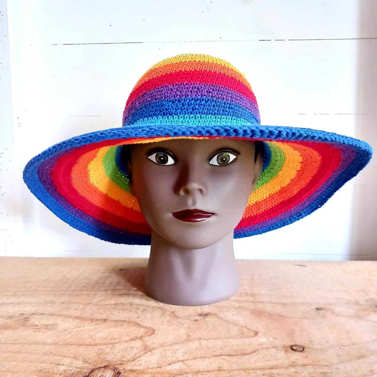 This lovely Rainbow crochet sun hat is handmade and Fairtrade from Indonesia. Each hat has a malleable wire woven into the rim to help keep the shape. The hat is wide brimmed and provides protection from the sun, so perfect for any summer outdoor activity.