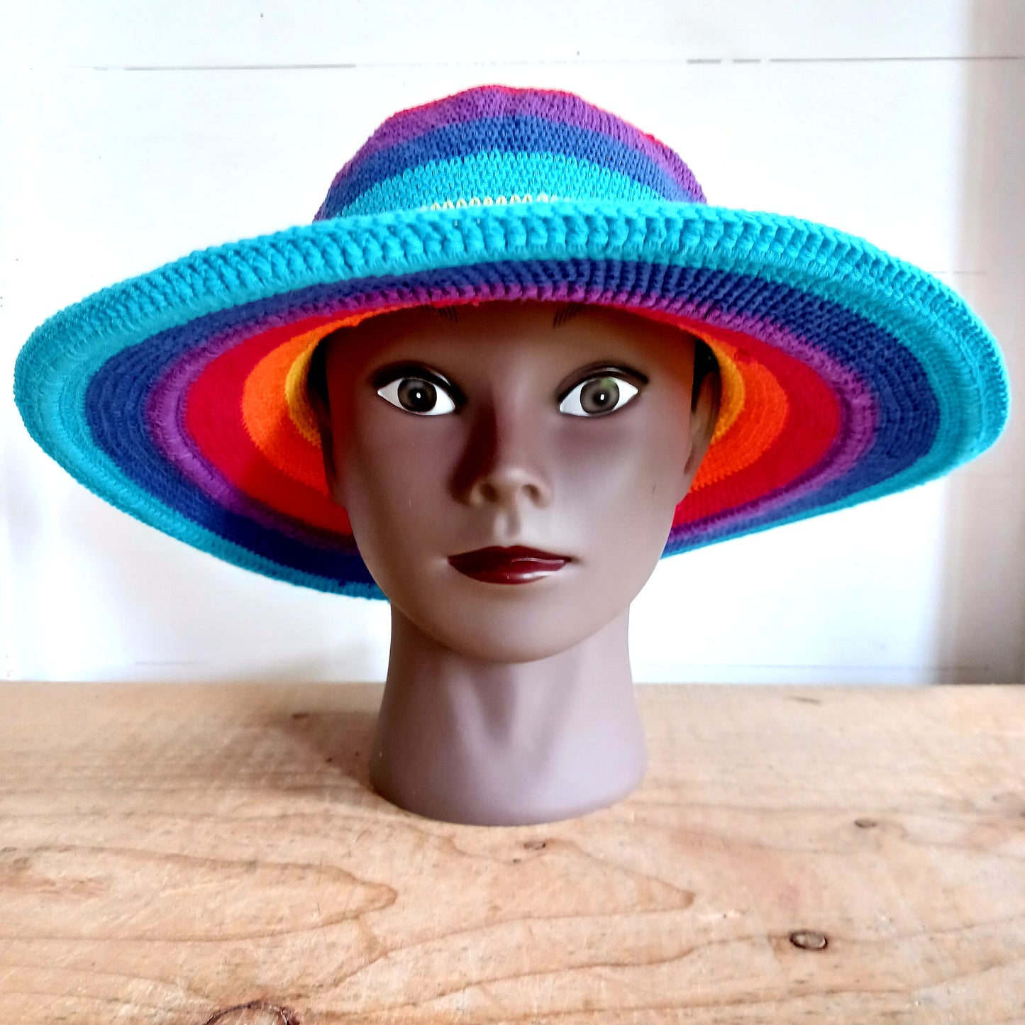 This lovely Rainbow crochet sun hat is handmade and Fairtrade from Indonesia. Each hat has a malleable wire woven into the rim to help keep the shape. The hat is wide brimmed and provides protection from the sun, so perfect for any summer outdoor activity.