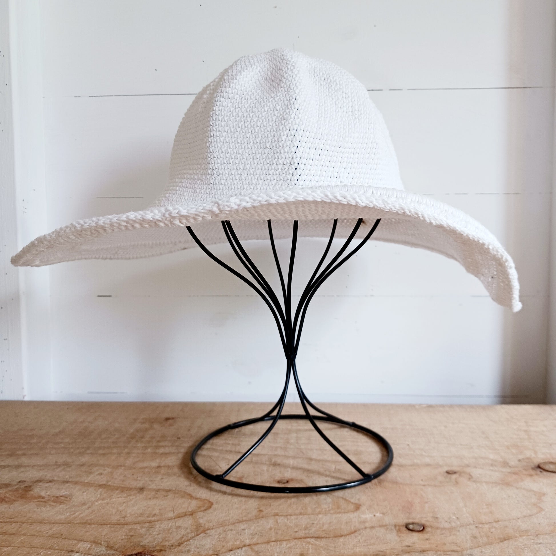 This lovely white crochet sun hat is handmade and Fairtrade from Indonesia. Each hat has a malleable wire woven into the rim to help keep the shape. The hat is wide brimmed and provides protection from the sun, so perfect for any summer outdoor activity.