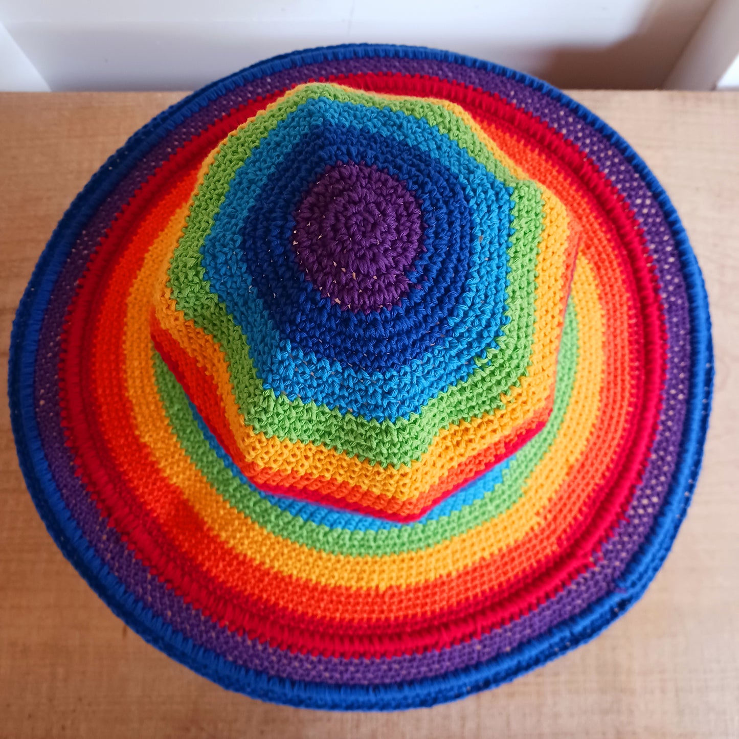 This lovely Rainbow crochet sun hat is handmade and Fairtrade from Indonesia. Each hat has a malleable wire woven into the rim to help keep the shape. The hat is wide brimmed and provides protection from the sun, so perfect for any summer outdoor activity.