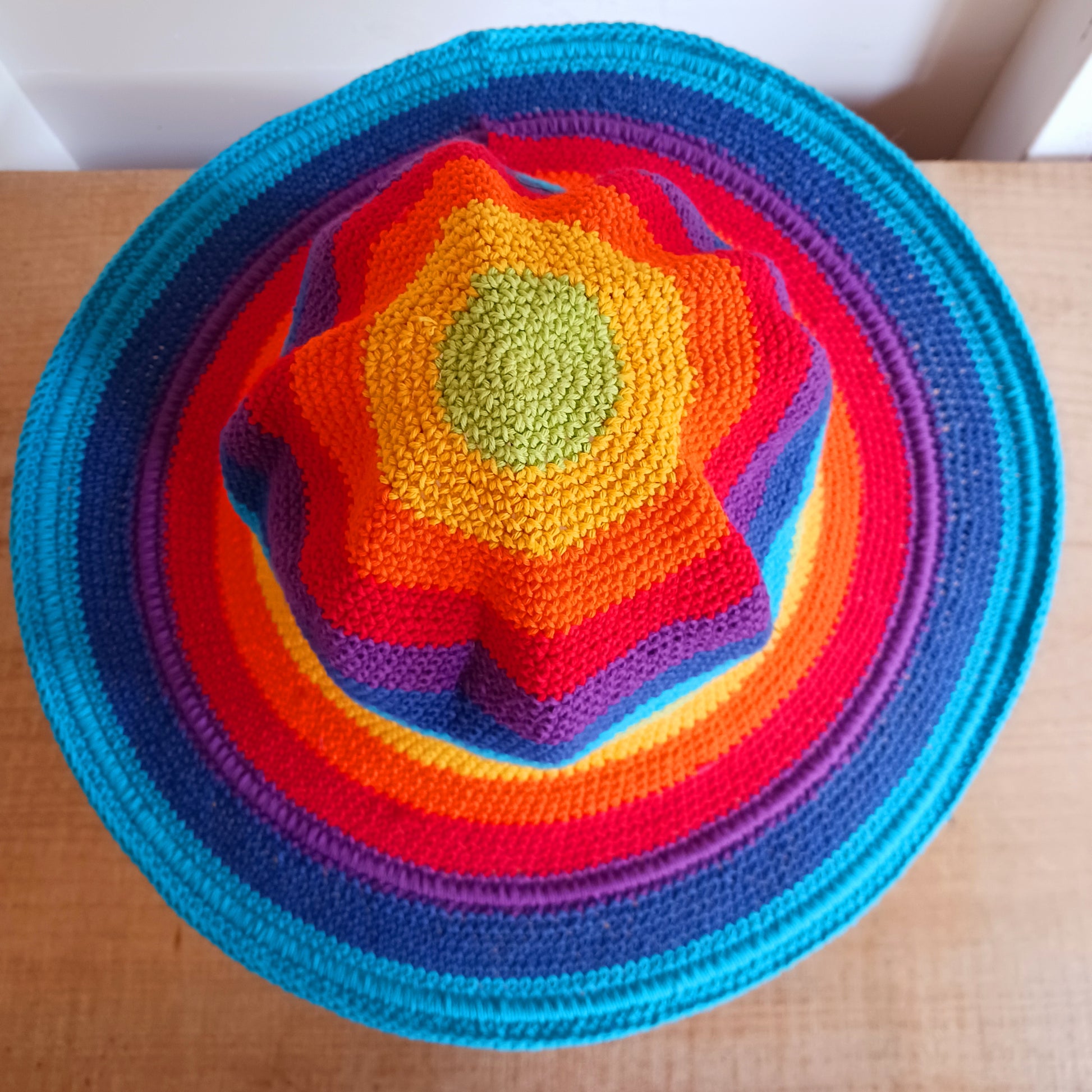 This lovely Rainbow crochet sun hat is handmade and Fairtrade from Indonesia. Each hat has a malleable wire woven into the rim to help keep the shape. The hat is wide brimmed and provides protection from the sun, so perfect for any summer outdoor activity.