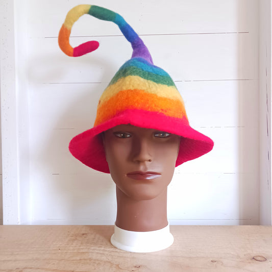 Fantastically fun, furiously fuzzy felt hats, all handmade in Nepal. These hats are made in wonderful and vivid rainbow stripes, and have a thin wire in the top part for bending to any crazy pixie position you like, perfect for being spotted in a crowd!