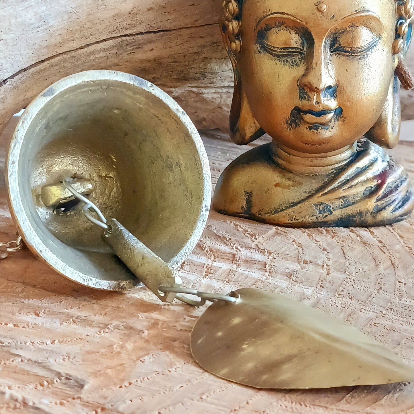 This hanging bell is made of brass in traditional Temple bell design. The sound is beautifully clear, light and airy. It is perfect to hang in your garden outdoors or hanging indoors as a decorative item.