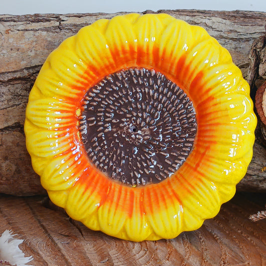 Refresh your senses with this pretty ceramic incense holder shaped like a classic sunflower. Bright and cheerful, this ceramic holder will look charming on a side table or nightstand while catching falling ash.