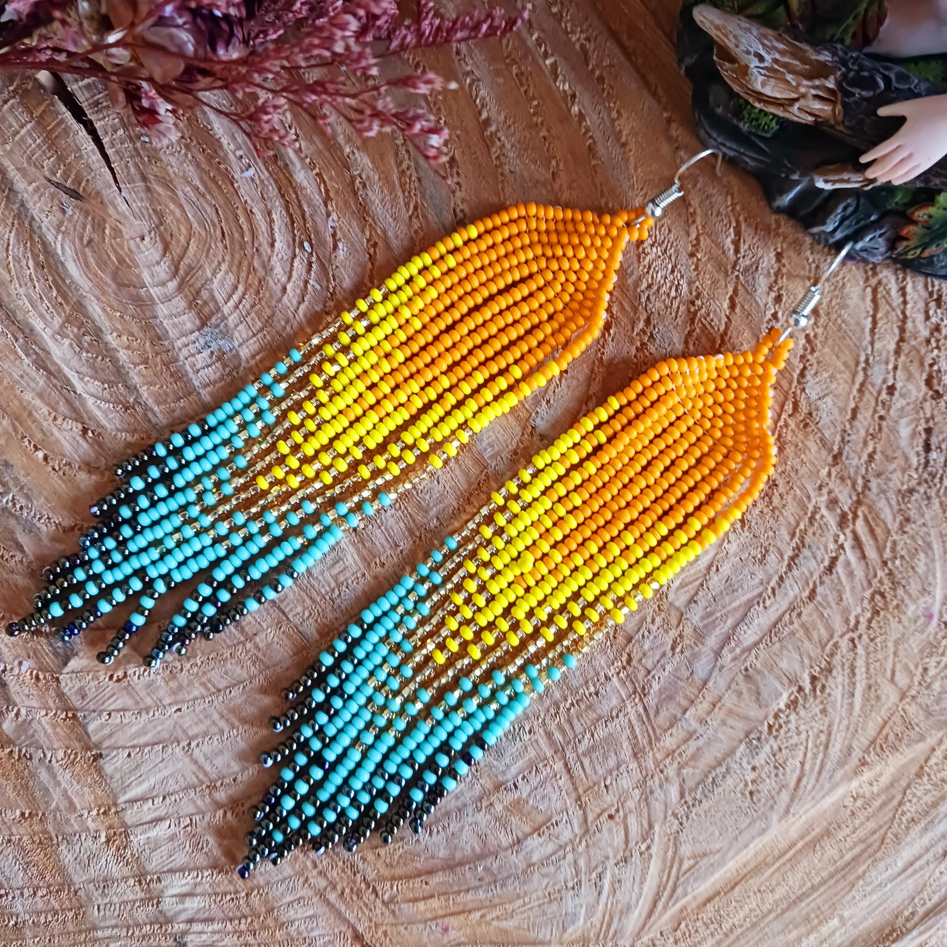 These bold and beautiful earrings are handsewn in Guatemala. Beadwork is a relatively new handicraft in Guatemala, around fifteen years or so, but it has been picked up all across the country and you will see it being sold at almost every market.