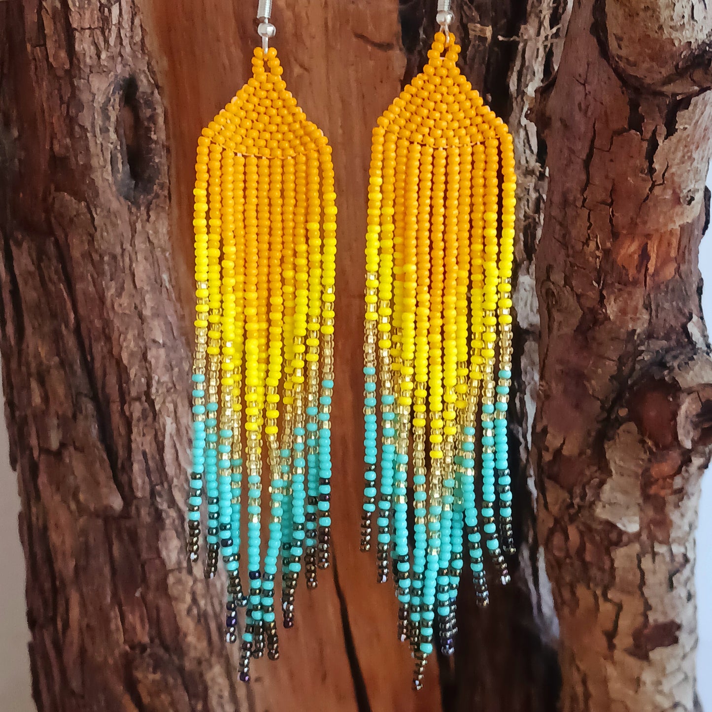 These bold and beautiful earrings are handsewn in Guatemala. Beadwork is a relatively new handicraft in Guatemala, around fifteen years or so, but it has been picked up all across the country and you will see it being sold at almost every market.