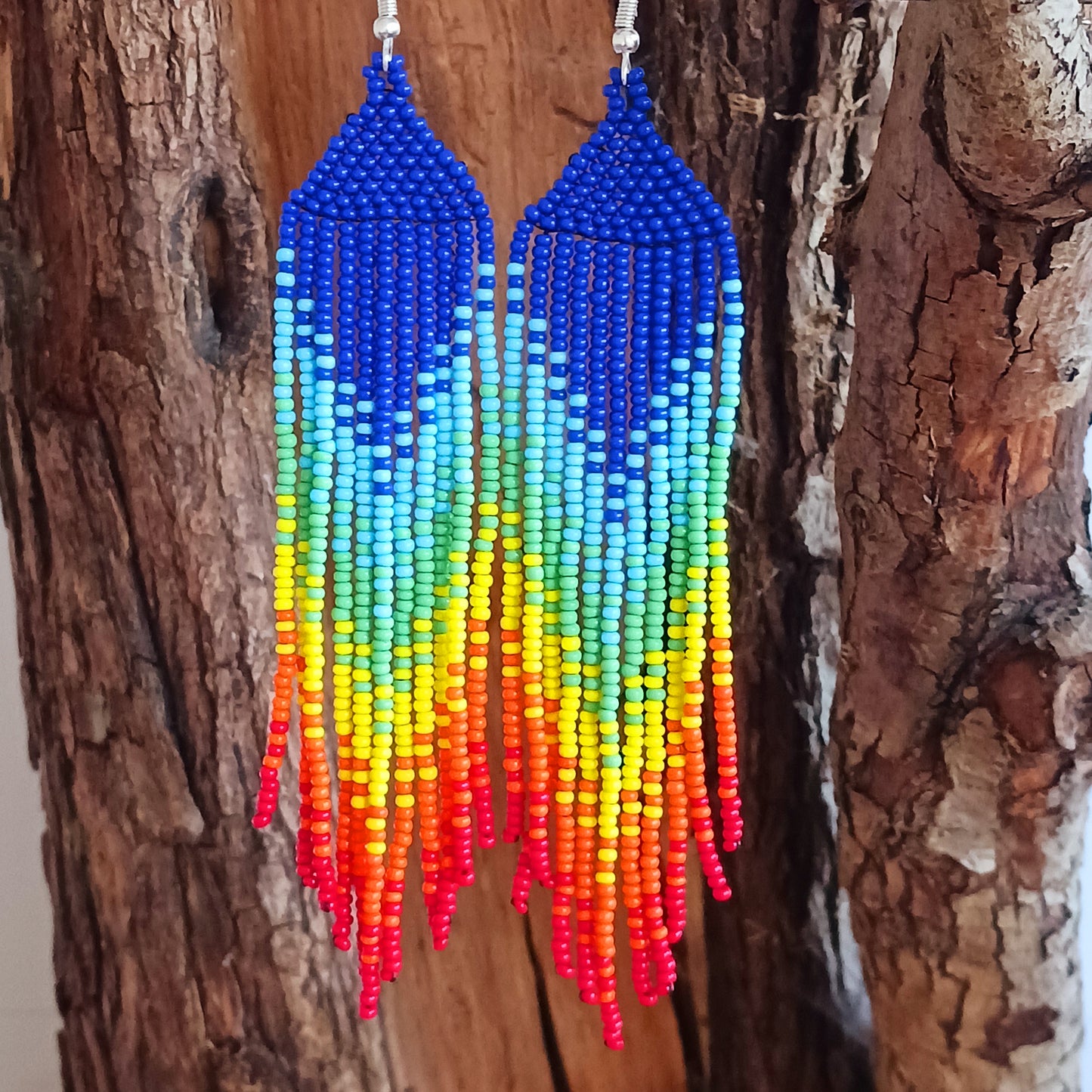 These bold and beautiful earrings are handsewn in Guatemala. Beadwork is a relatively new handicraft in Guatemala, around fifteen years or so, but it has been picked up all across the country and you will see it being sold at almost every market.