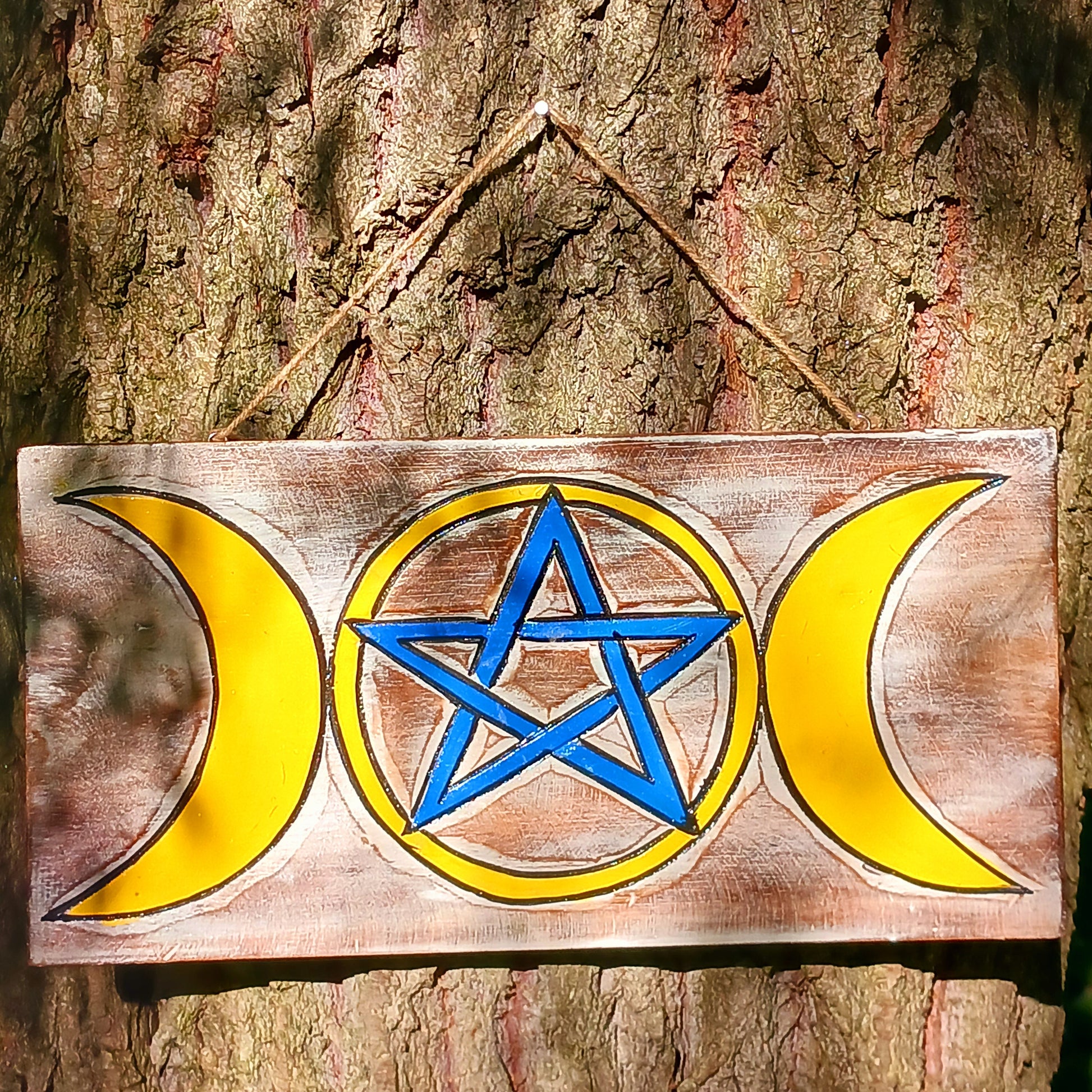 This cool wall plaque has a white wash effect with vibrant hand painted design featuring the triple goddess and pentacle symbols.