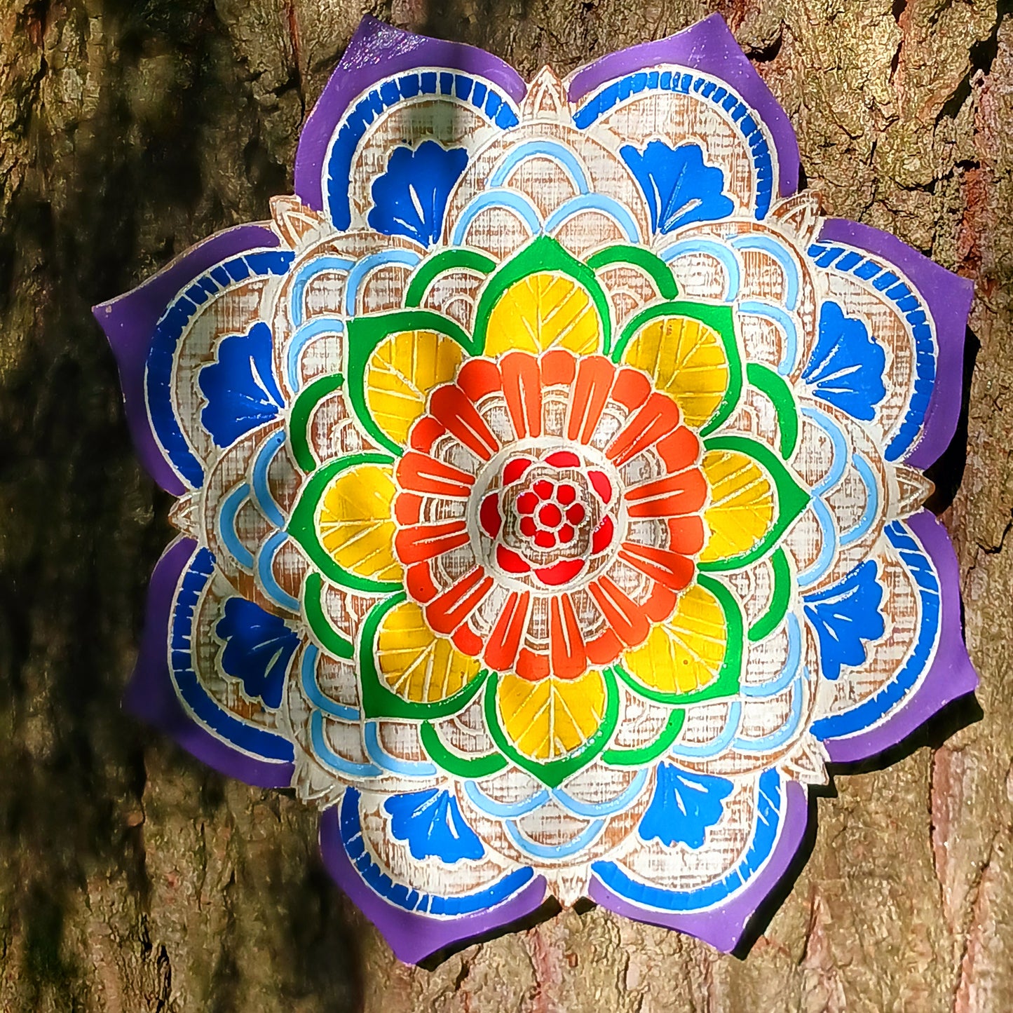 This superbly intricate wooden mandala plaque features the seven chakra colours and a rustic finish to the exposed wood.