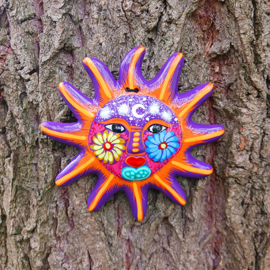 This sunny and vibrant wall plaque will get you smiling! It has been beautifully hand painted in a bright style traditional to Xalitla, a region of Guerrero, Mexico. A striking glaze adds to the bold design. It has two holes which can be used to add a hanging loop for an easy display.