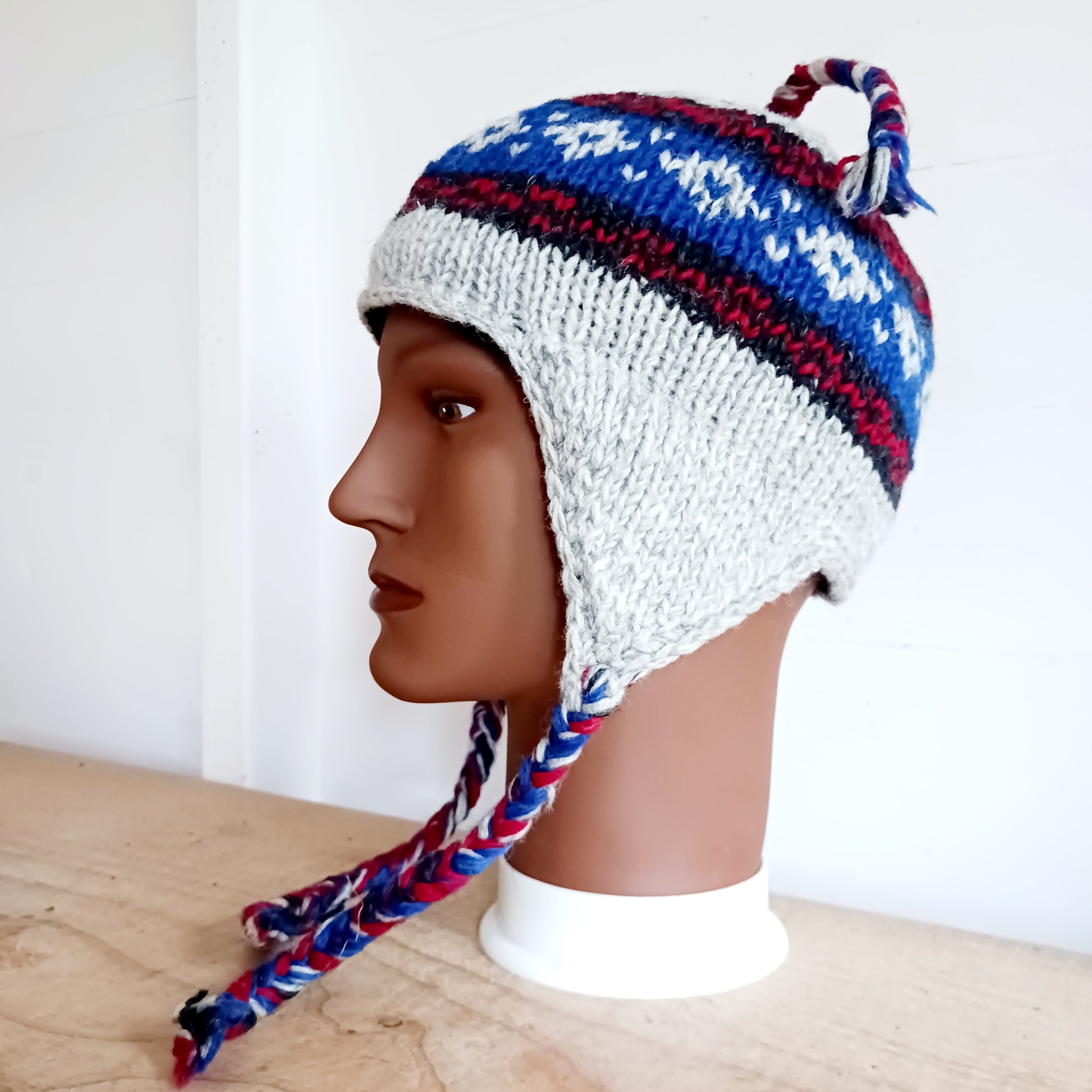 Chunky wool earflap hats hand made in Nepal with fleece lining for extra warmth and comfort, this handmade hat is awesomely warm.