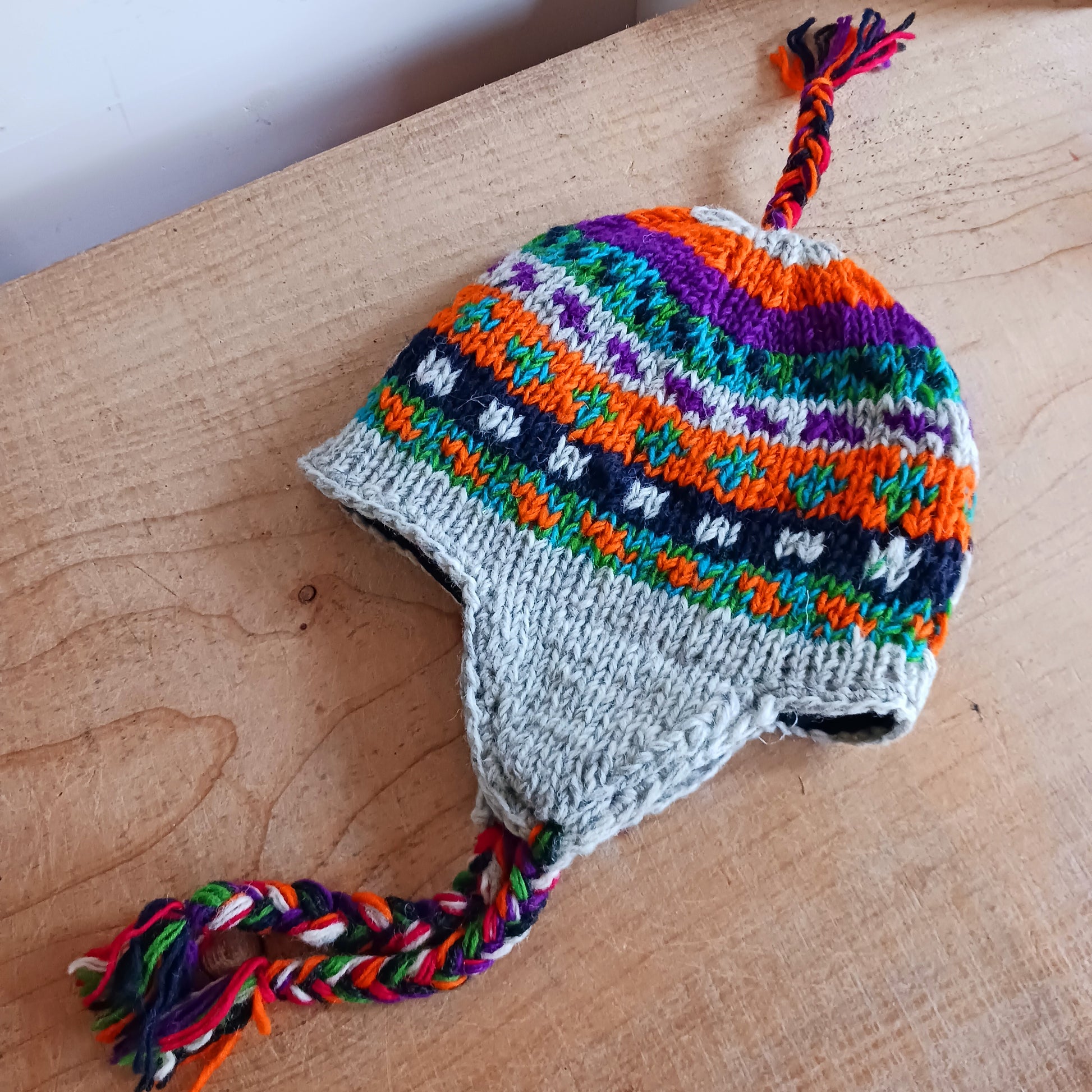 Chunky wool earflap hats hand made in Nepal with fleece lining for extra warmth and comfort, this handmade hat is awesomely warm.