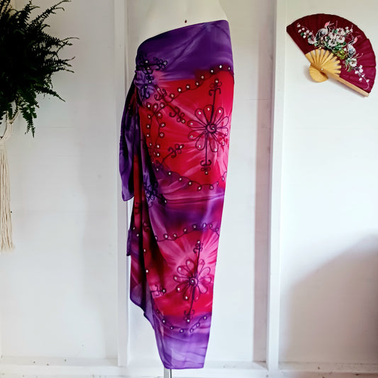 Beautifully dazzling cosmic sarongs combine the multiple colours of tie-dye, decorative embroidery and shimmering sequins all in one sarong. Each sarong has a little extra width, and finished edges (no fringe).