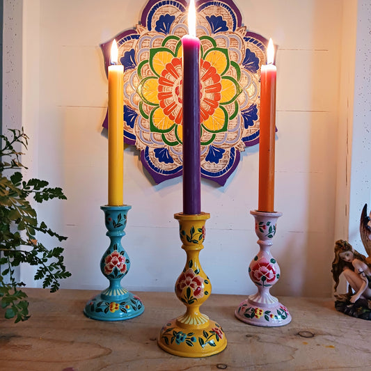 These beautifully hand crafted Kashmiri candle holders have been hand painted in vibrant, decorative colours of pink, yellow and turquoise. These unique candlesticks will fill any space with elegant grandeur. Intricate flower petals and delicate foliage are finished to a high shine glaze to boost the intensity of a captivating design.