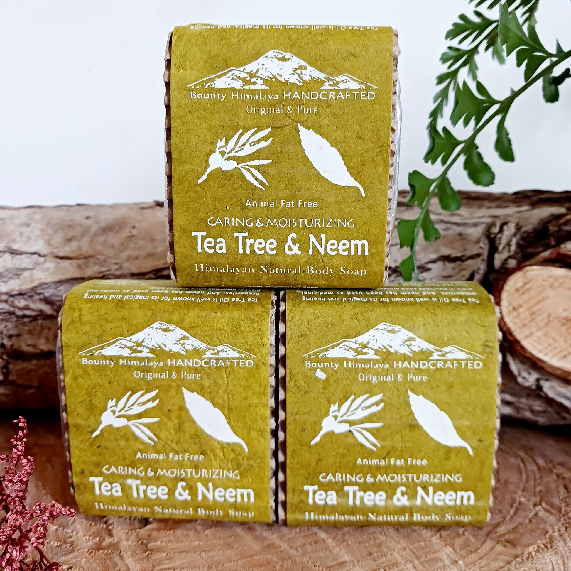 Handmade natural soap made in true artisan style by just a few workers in a tiny workshop in the foothills of the Himalayas. Each bar is wrapped in natural Lokta paper. This natural Tea Tree and Neem soap can be used on face and body and is soothing and moisturizing.