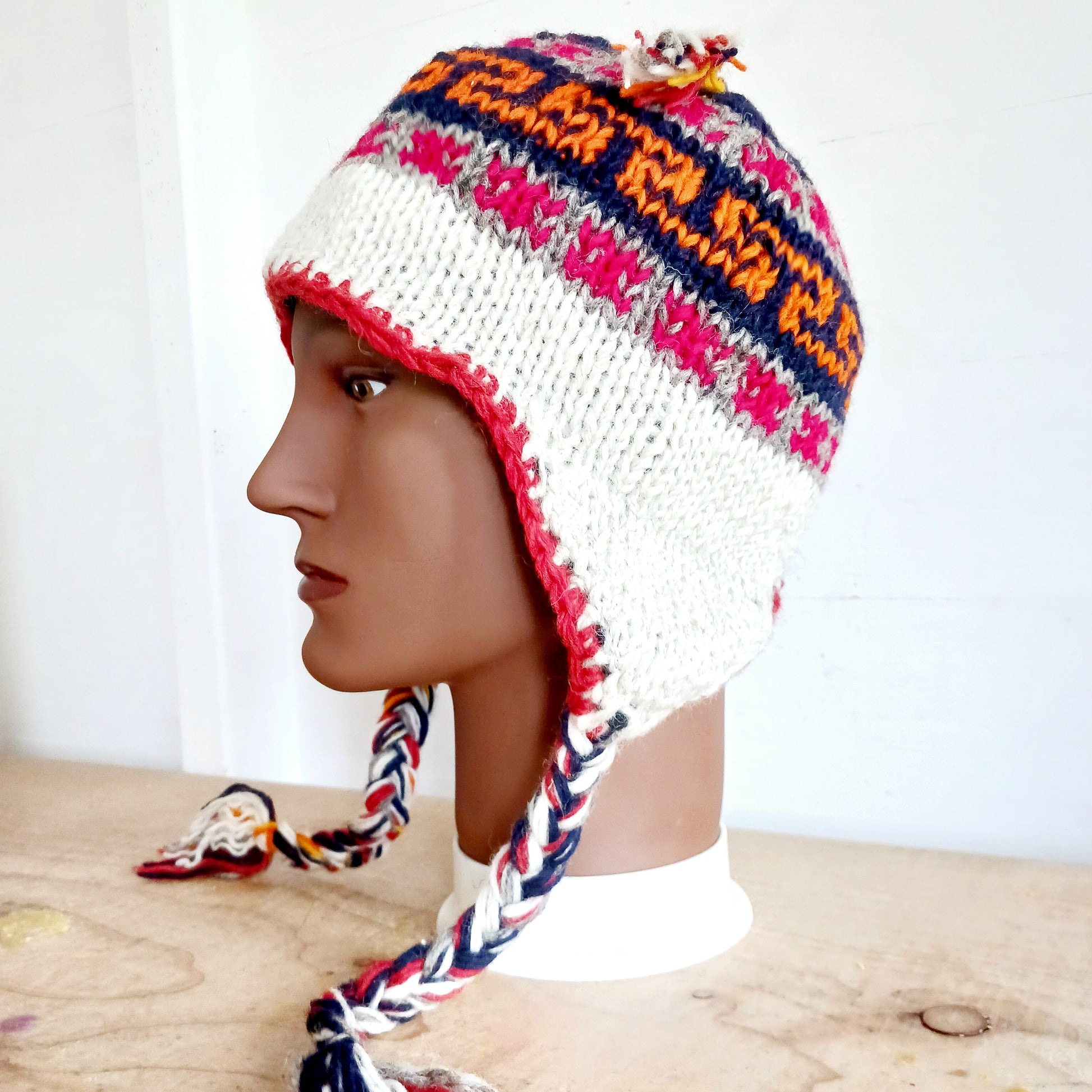 Our Hand knitted Woollen Ear Flaps Hat are 100% wool and very warm. They are all hand knitted by the Kathmandu women in their homes. Lined with Polar Fleece for extra warmth and cozyness.