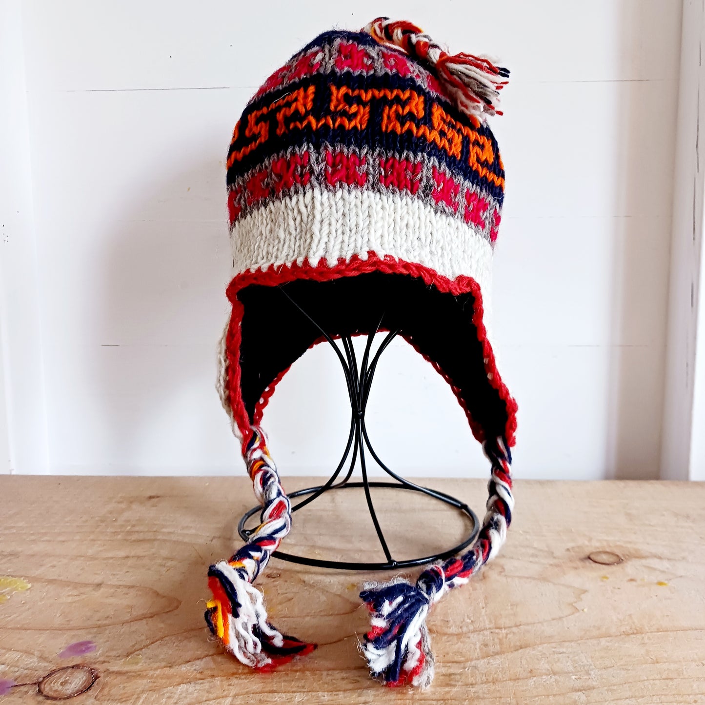 Our Hand knitted Woollen Ear Flaps Hat are 100% wool and very warm. They are all hand knitted by the Kathmandu women in their homes. Lined with Polar Fleece for extra warmth and cozyness.