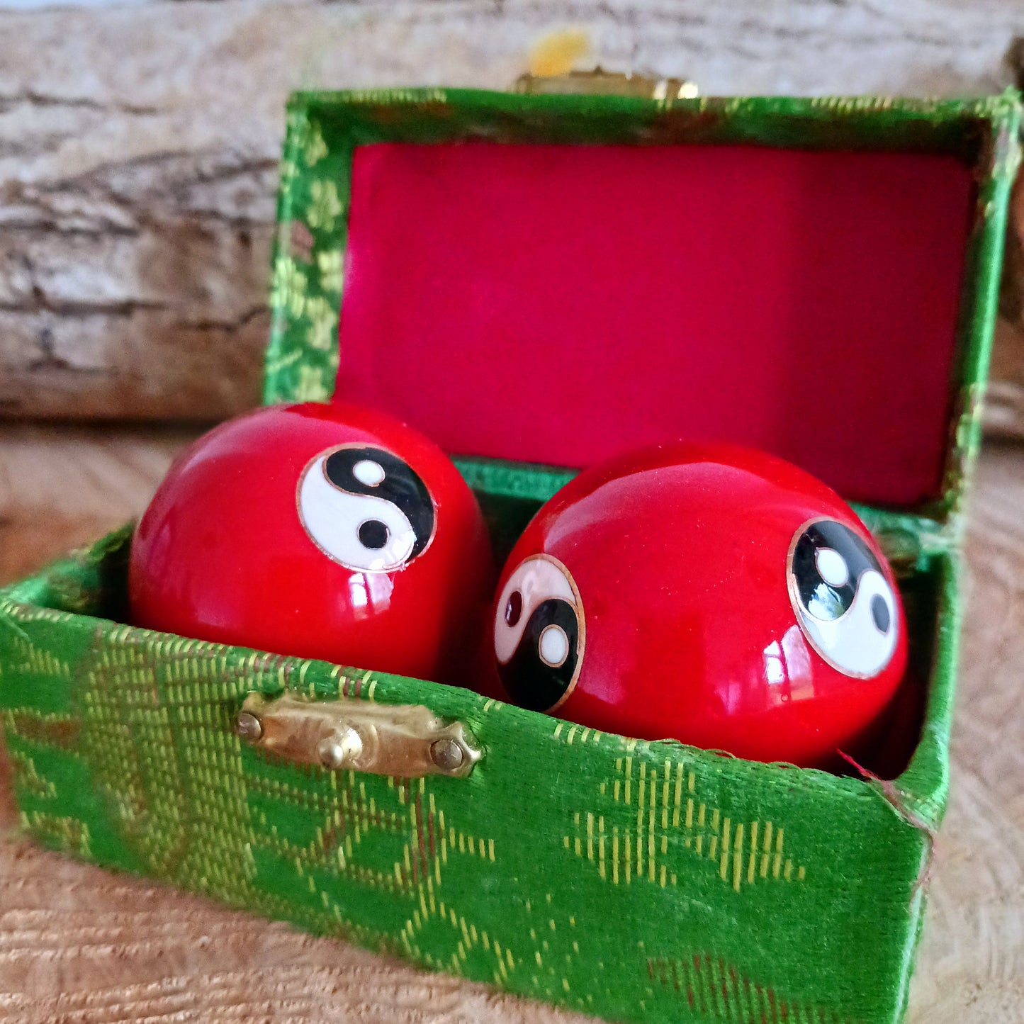 There is a sound mechanism inside the health balls causing a tender sound. Each health ball has a diameter of about 4 cms. They come in a set of two, in a padded brocade box of beautiful Chinese silk embroidery.