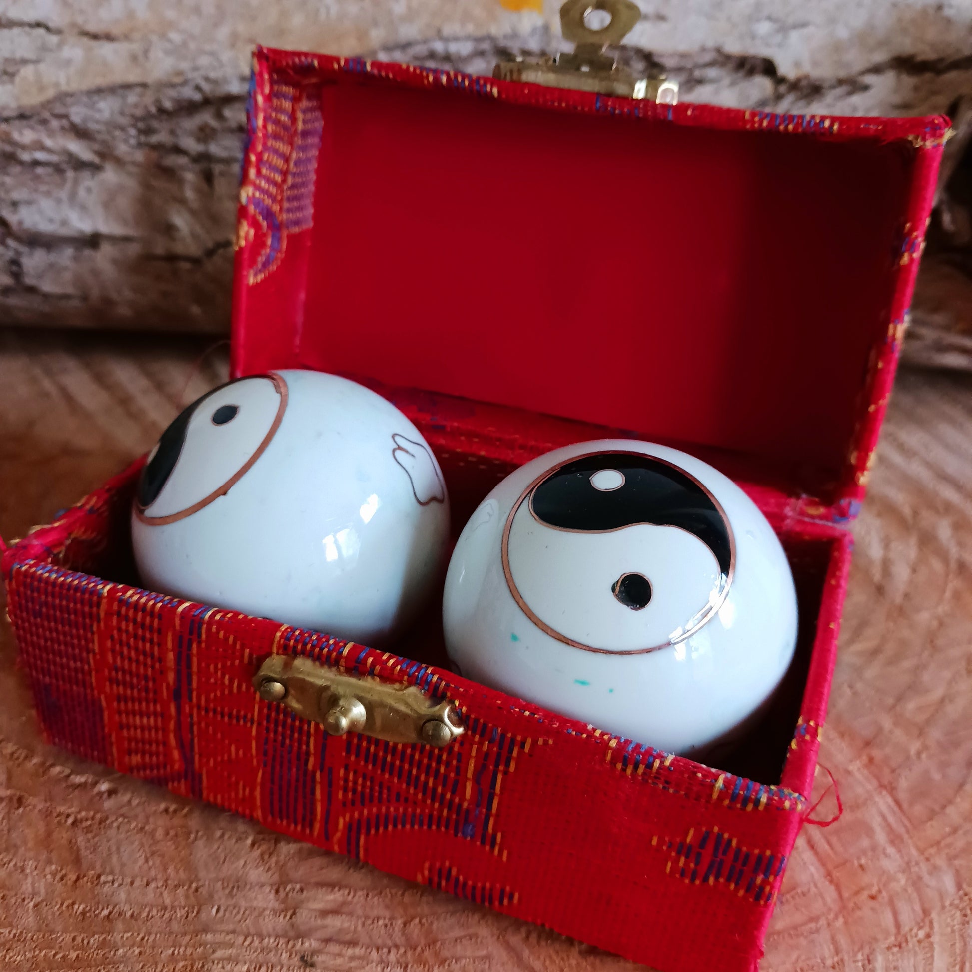 There is a sound mechanism inside the health balls causing a tender sound. Each health ball has a diameter of about 4 cms. They come in a set of two, in a padded brocade box of beautiful Chinese silk embroidery.