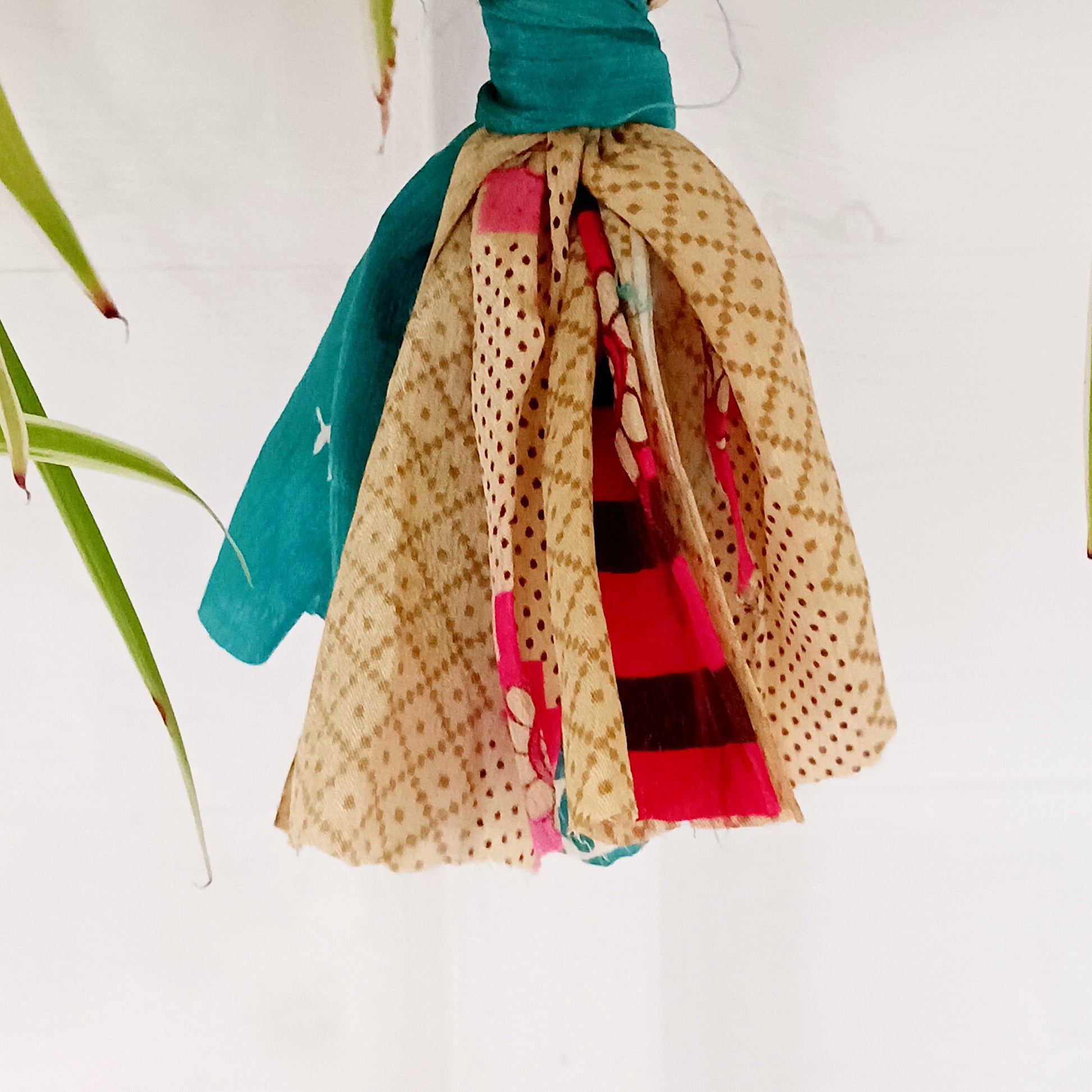 These lovely handmade sari plant hangers will add a splash of colour and boho chic to your home. Made from scraps of used sari, their simple design ensures that no fabric is wasted but is re-purposed into an elegant product. They will fit around most sized pots and features a strong metal ring for hanging.