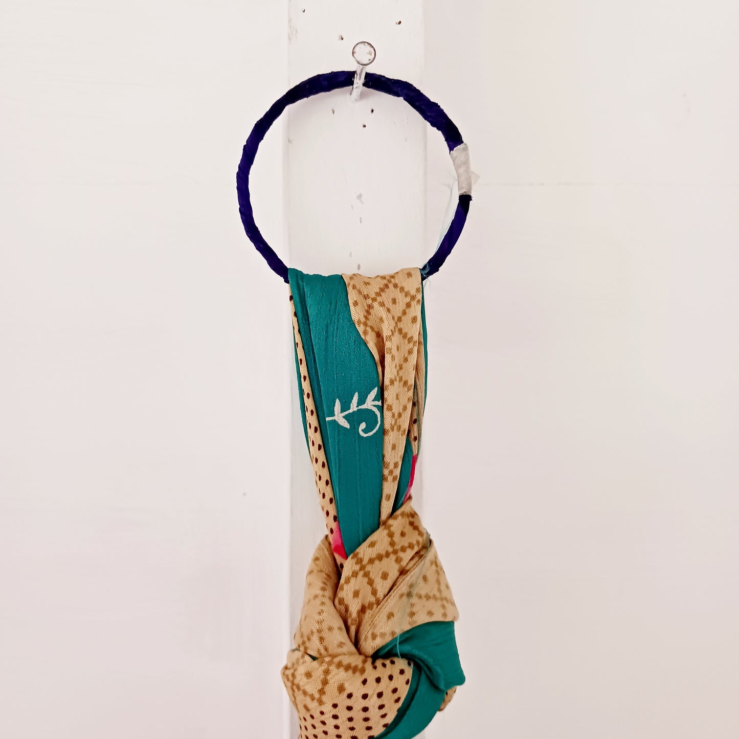 These lovely handmade sari plant hangers will add a splash of colour and boho chic to your home. Made from scraps of used sari, their simple design ensures that no fabric is wasted but is re-purposed into an elegant product. They will fit around most sized pots and features a strong metal ring for hanging.