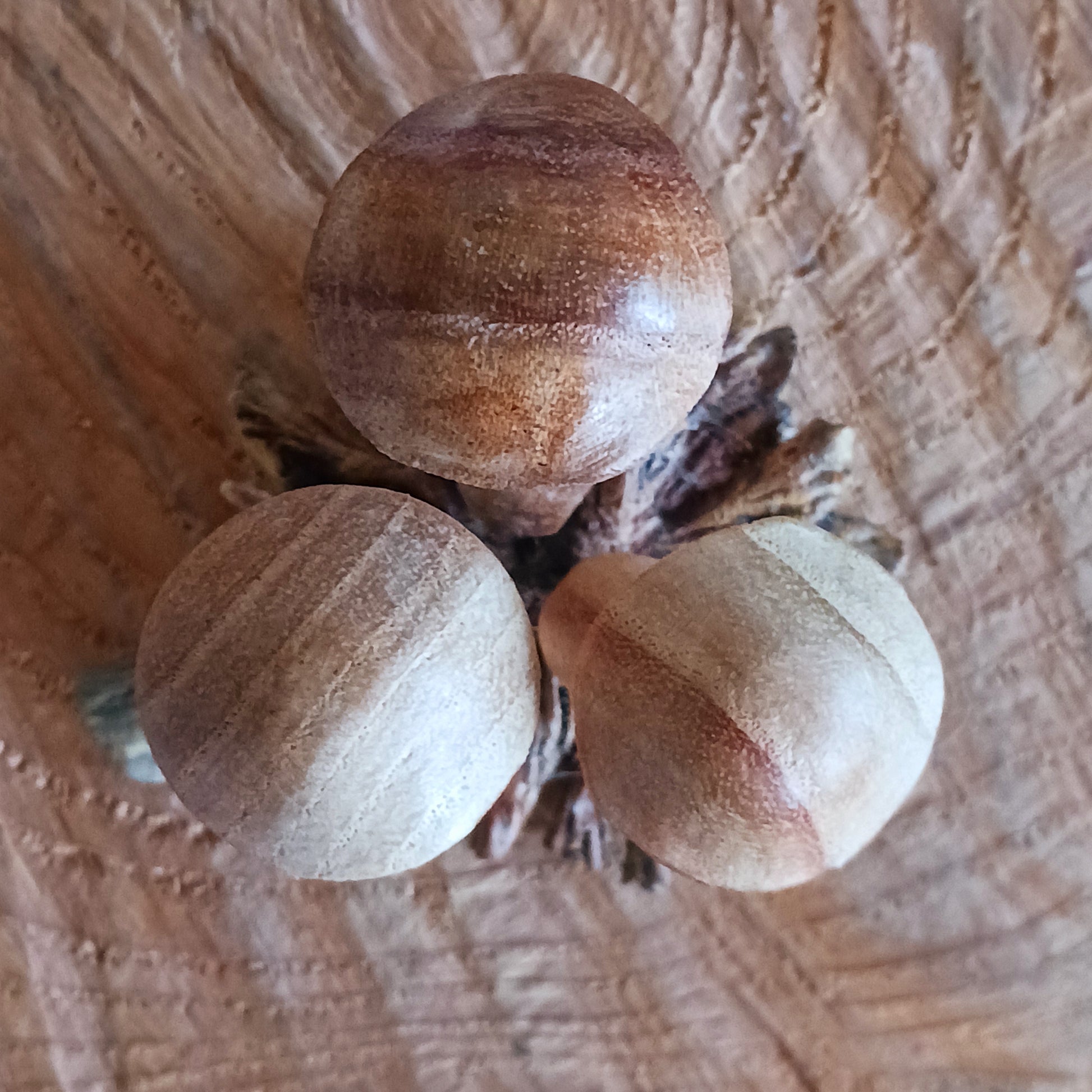 These collections of little hand carved wooden mushrooms have been carefully carved in white wood to fit perfectly into this fascinating wood rose formation.