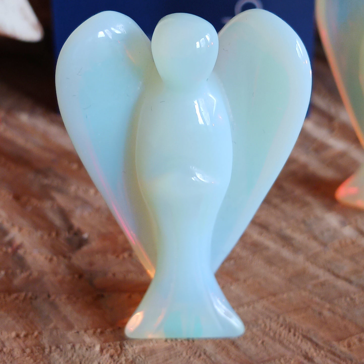 These beautiful angels are hand carved from Opalite. Opalite is treasured for its array of metaphysical properties, including its calming influence, capacity to enhance communication, role in spiritual growth, and potential to boost intuition.