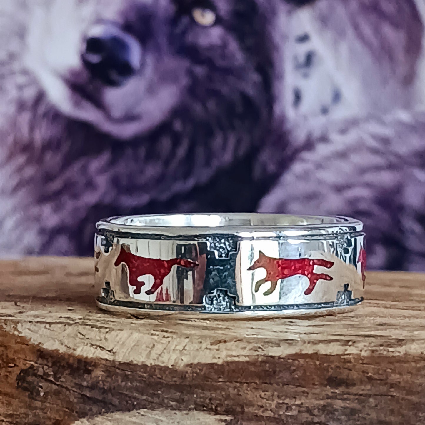 Shop the Naturally Brave Coral Wolf Band Ring, a stunning piece of Native American jewelry. Featuring intricate wolf designs and vibrant coral, this handcrafted ring embodies strength and tradition.