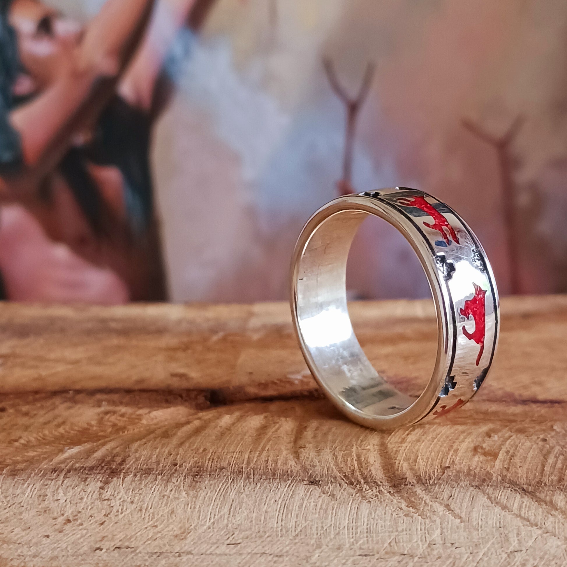 This solid sterling silver ring features a coral running wolf around the band. Southwestern Native-made Zuni jewellery embodies the rich cultural heritage and craftsmanship of the Zuni people, renowned for their intricate designs and meticulous attention to detail. Each piece is a testament to centuries-old traditions, handcrafted by skilled artisans who honor their ancestral techniques.